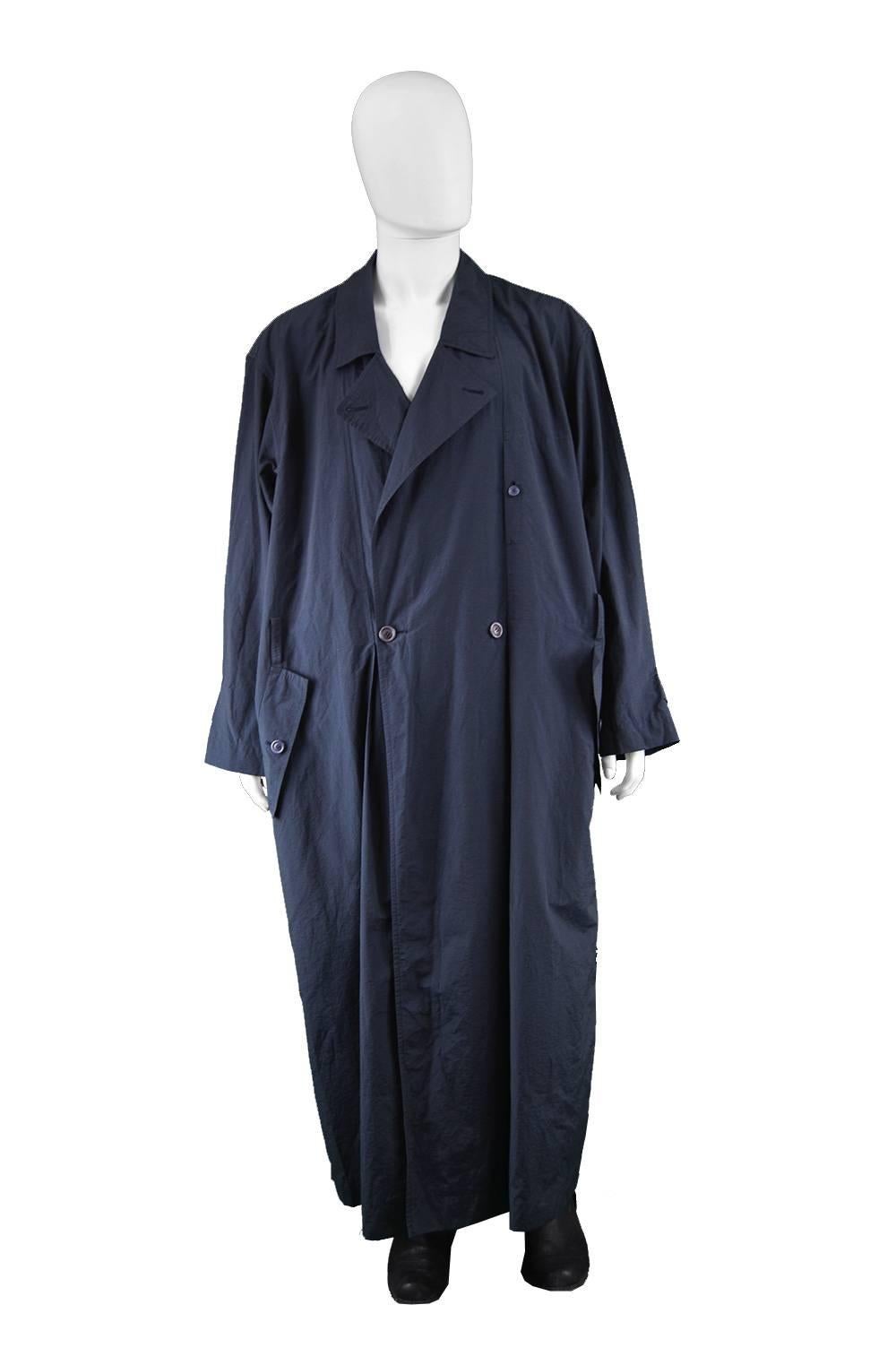 Issey Miyake Men Vintage 1980s Dark Navy Blue Maxi Trench Windcoat 

Size:  Marked M but fits most sizes due to oversized cut. Would suit a tall man or woman due to long maxi length. Please check measurements.
Chest - Free up to 56