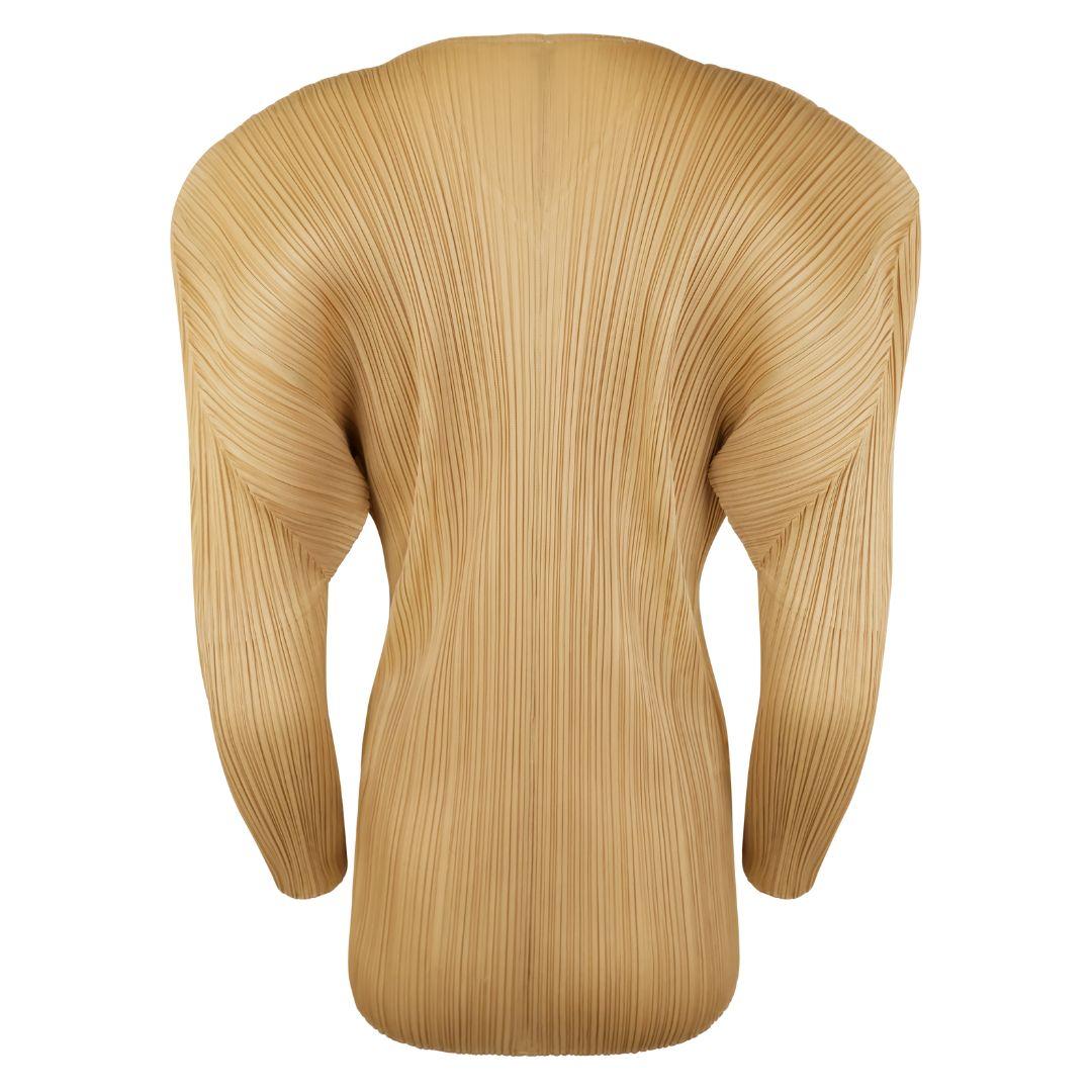 Issey Miyake Pleats Please gold/beige micro pleated sculptural cardigan with exaggerated shoulders.

Front panels create a v-neckline with round edges which taper from the chest outward toward the waistline and adds additional shape and