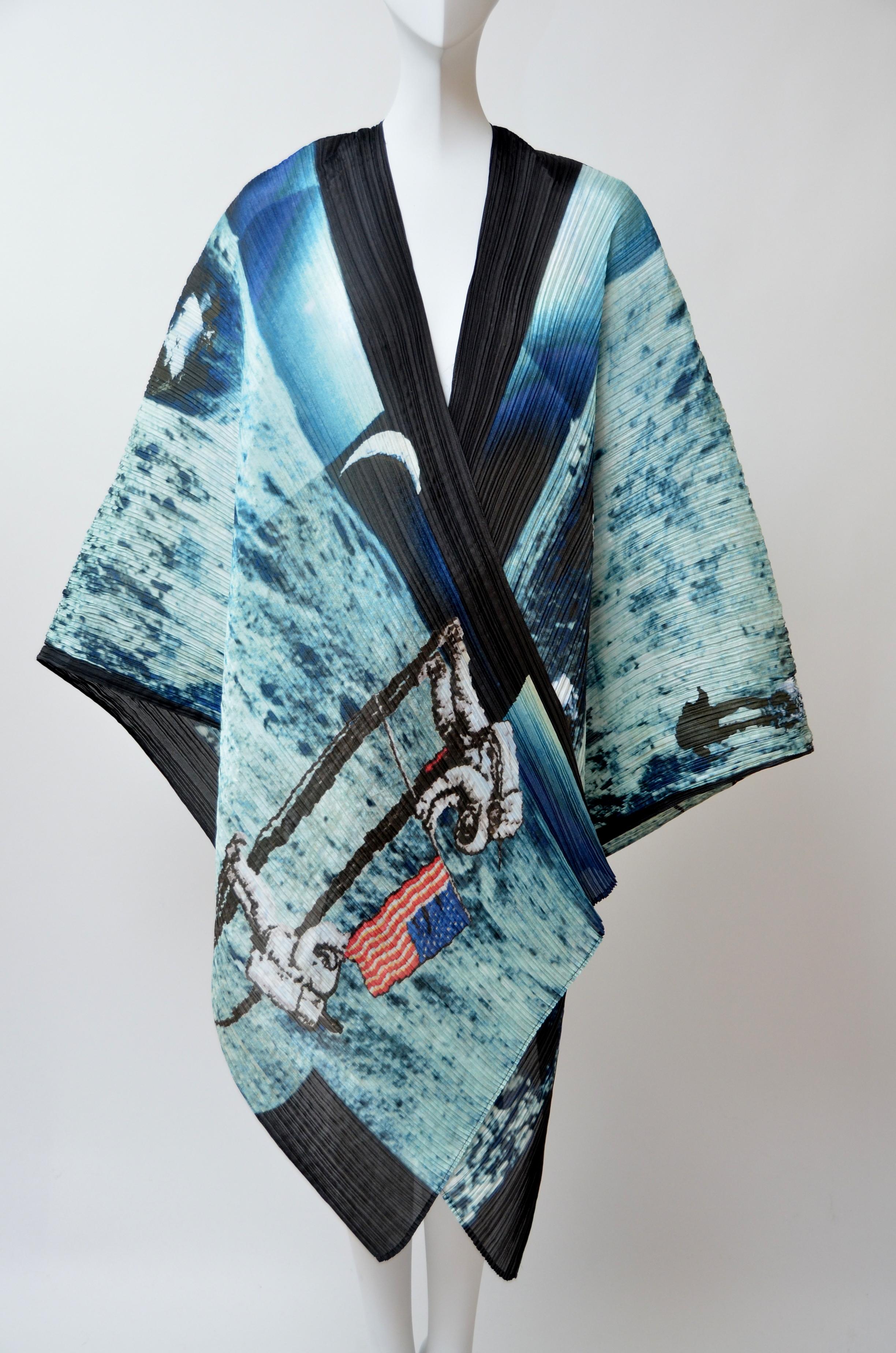 Blue and multicolor Pleats Please Issey Miyake pleated polyester shawl with Apollo's Moon Landing print throughout and finished edges
Length: 80