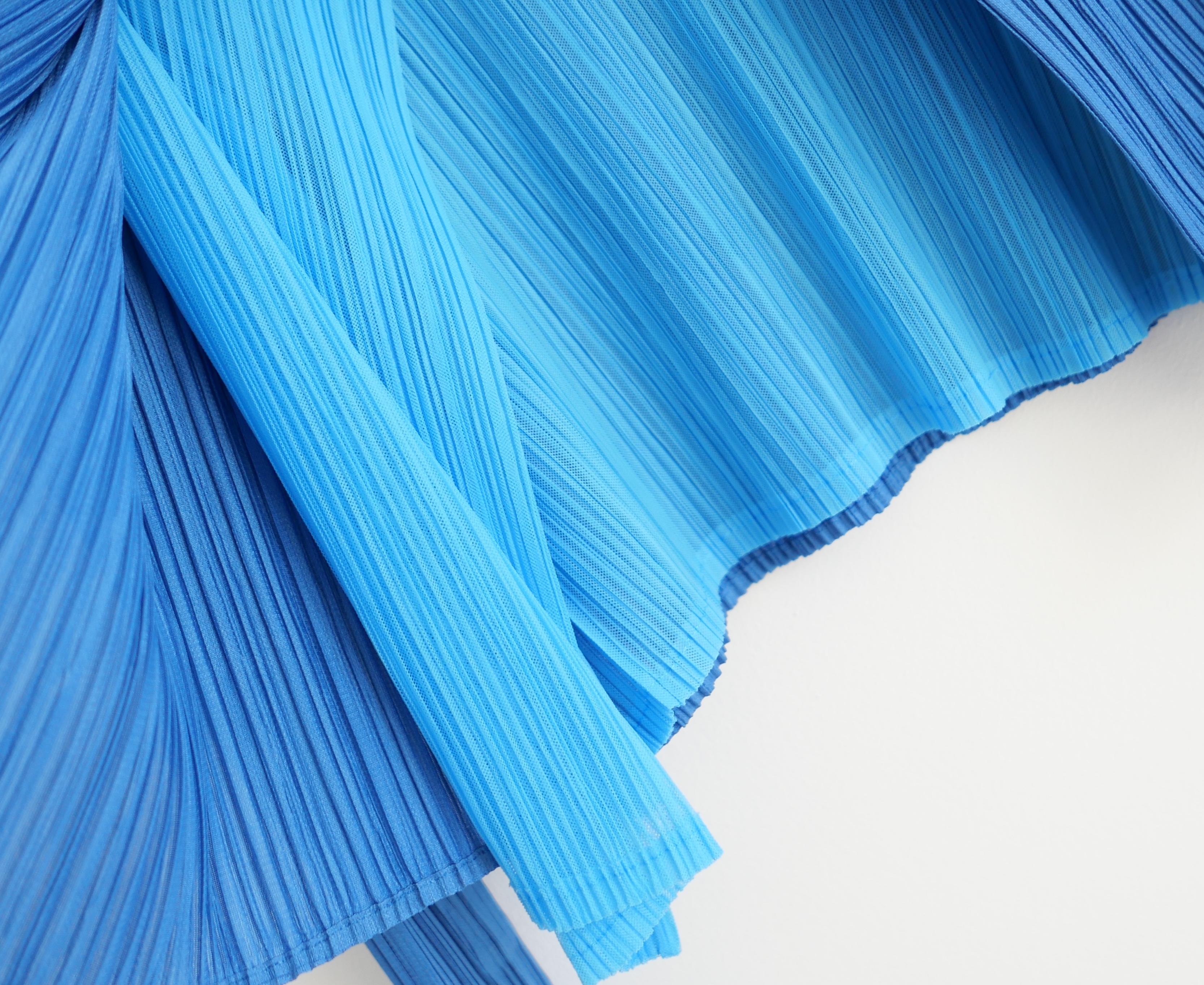 Gorgeous Issey Miyake Pleats Please double layered jacket. Made from signature pleated polyester in rich turquoise blue with a sheer pale blue inner body layer.  Has classic open front with long batwing cut sleeves. Code PP06 J0509 One size fits all