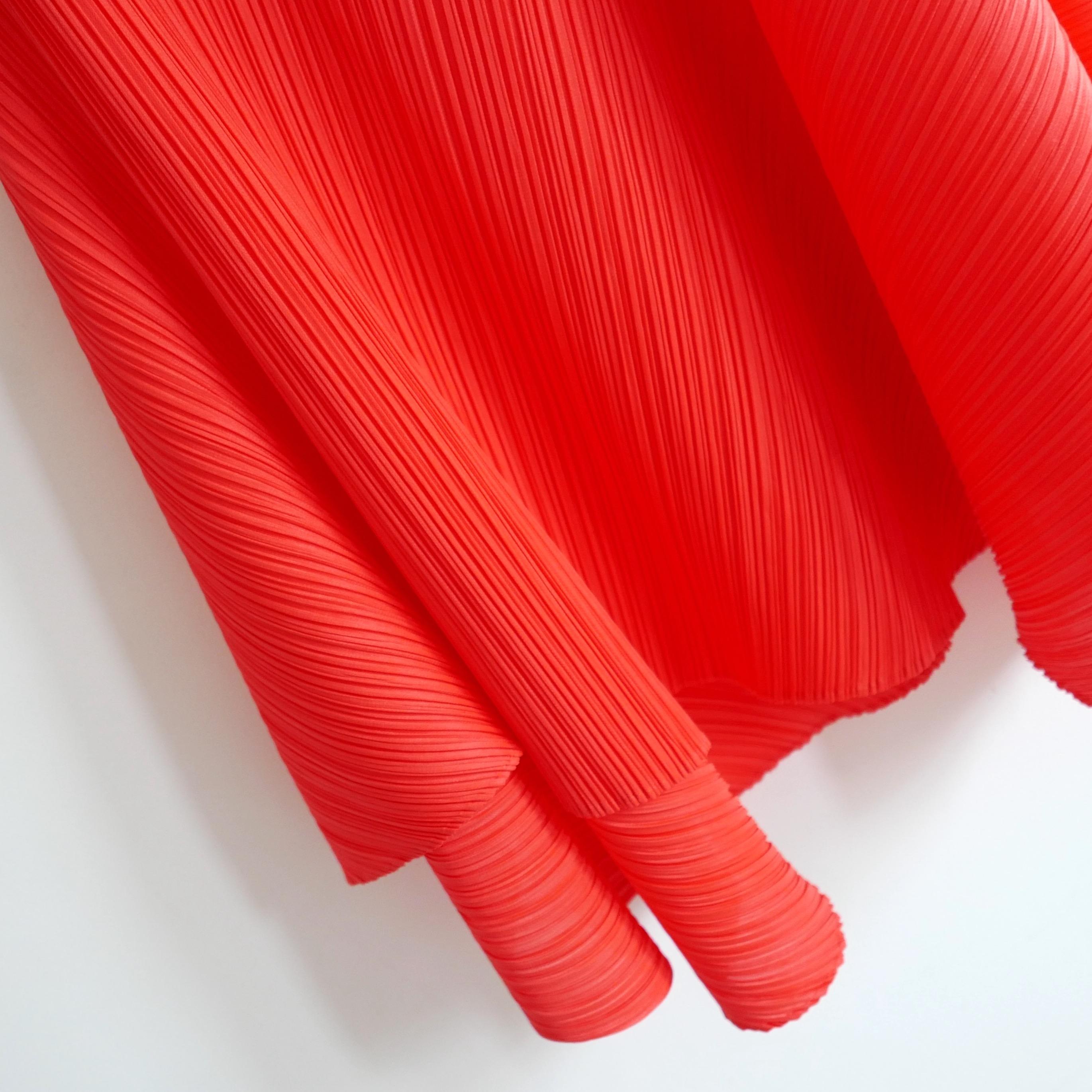 Absolutely gorgeous Issey Miyake Pleats Please dress. From the Spring 2018 collection. Worn a couple of times. Made from lightweight signature pleated polyester in a rich, bright orange colour. It has a super sculptural asymmetric panelled cut with