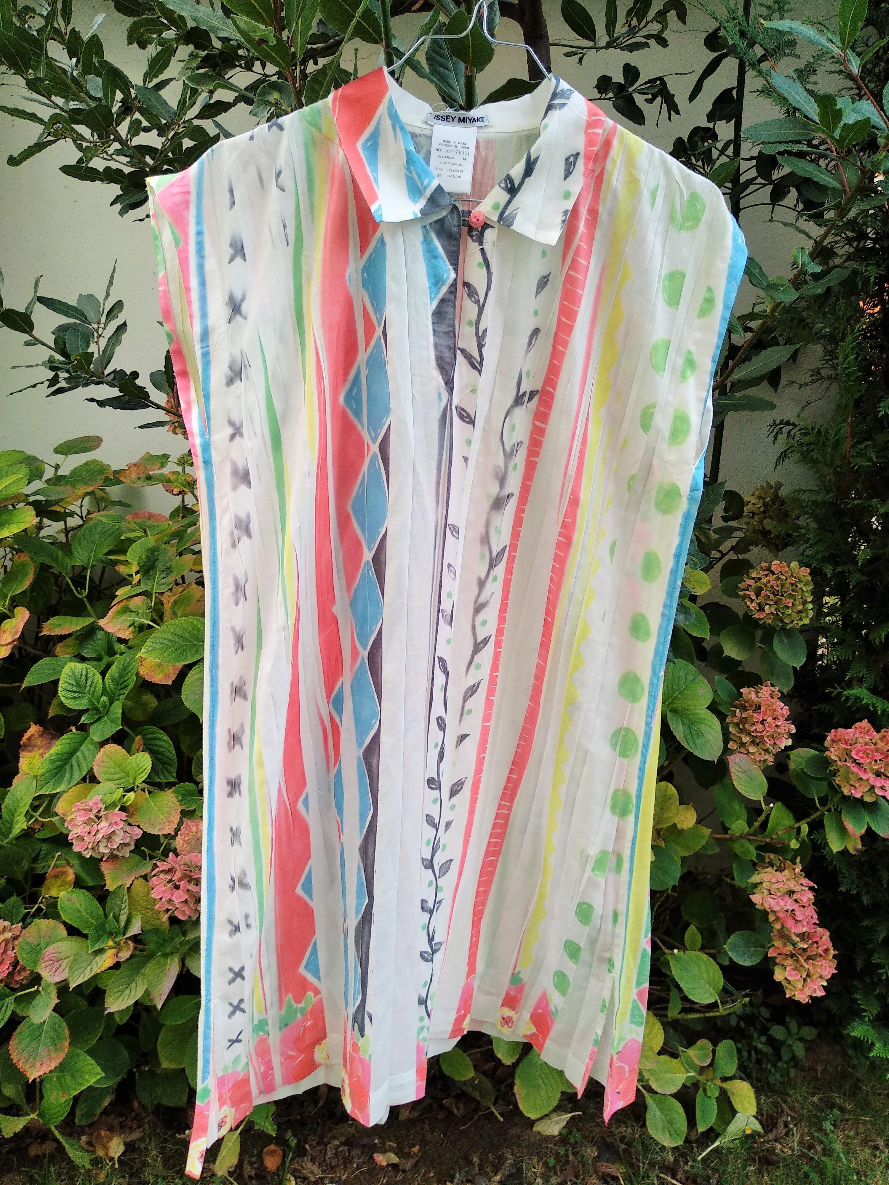 white dress with rainbow pleats