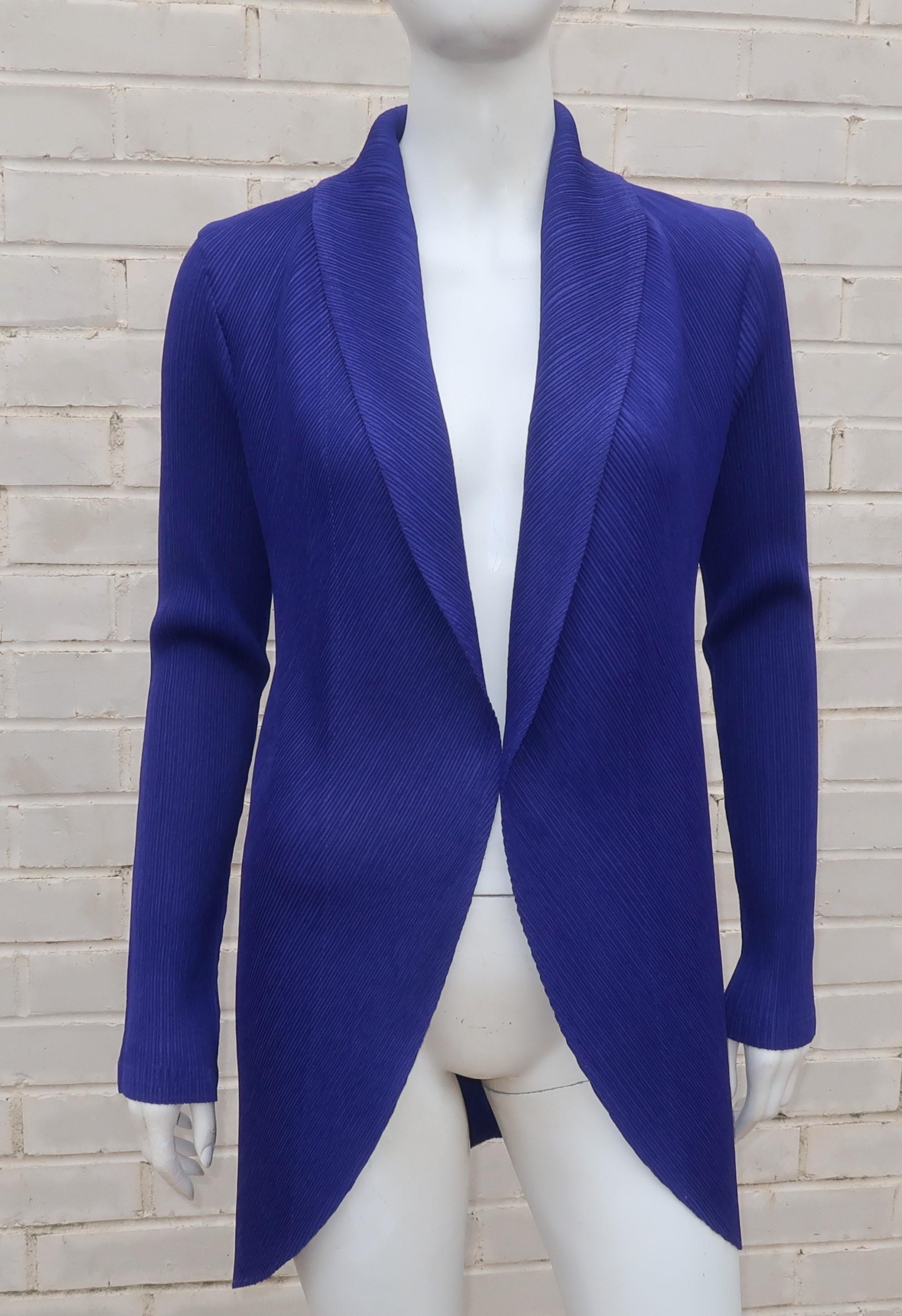 Issey Miyake White Label micro pleated royal purple jacket with an open construction, shawl collar and a cutaway style silhouette. A wonderful topper that will add a finished look to Miyake separates.  Very good condition.
SIZING & MEASUREMENTS
The