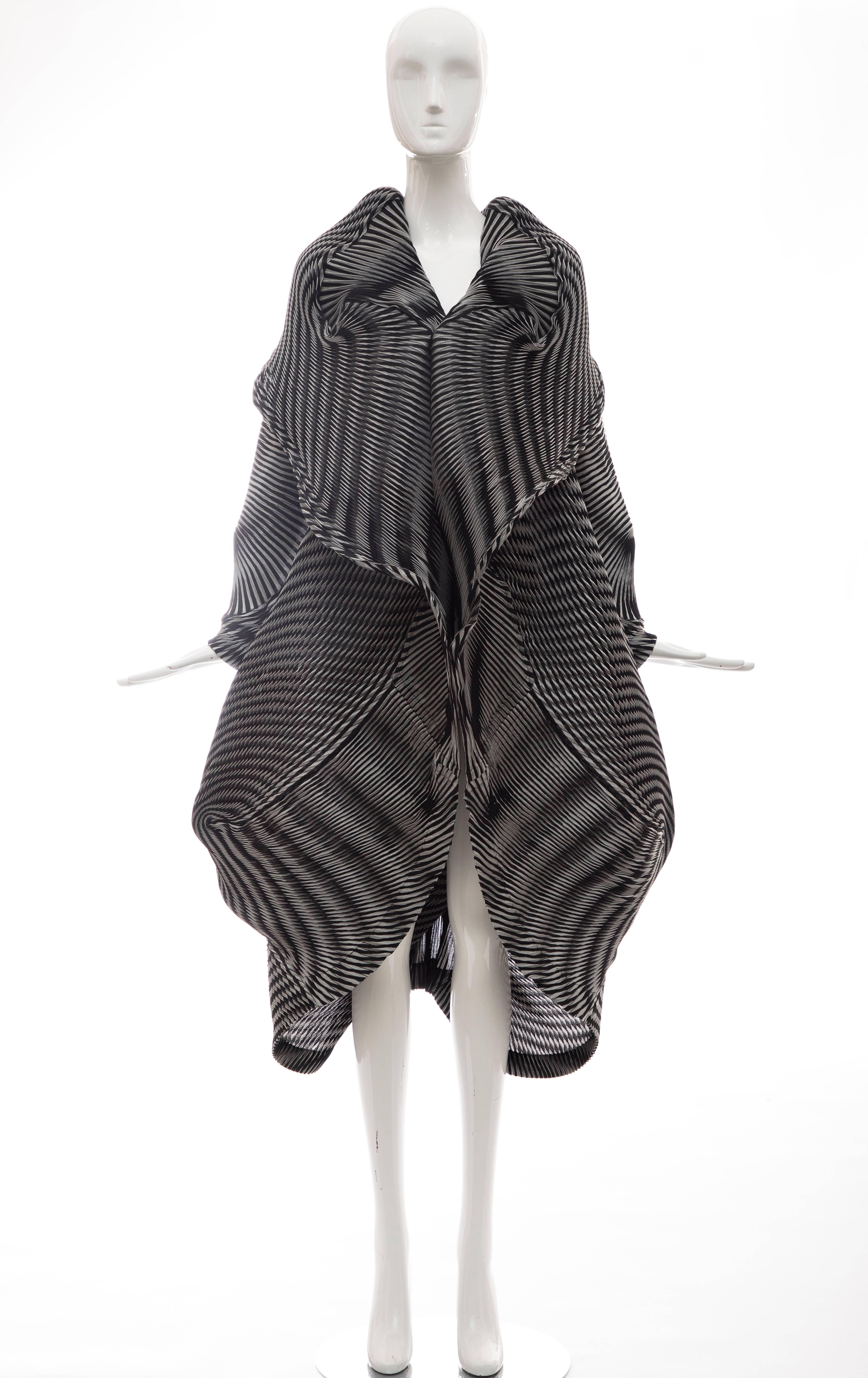 Issey Miyake, Fall 2016 runway (Look 38) spiral-pleated jacket with shawl collar, long sleeves and button closures at front.  

Designer size 2.

Bust: 50, Waist 50, Shoulder 18, Length 53, Sleeve 32
