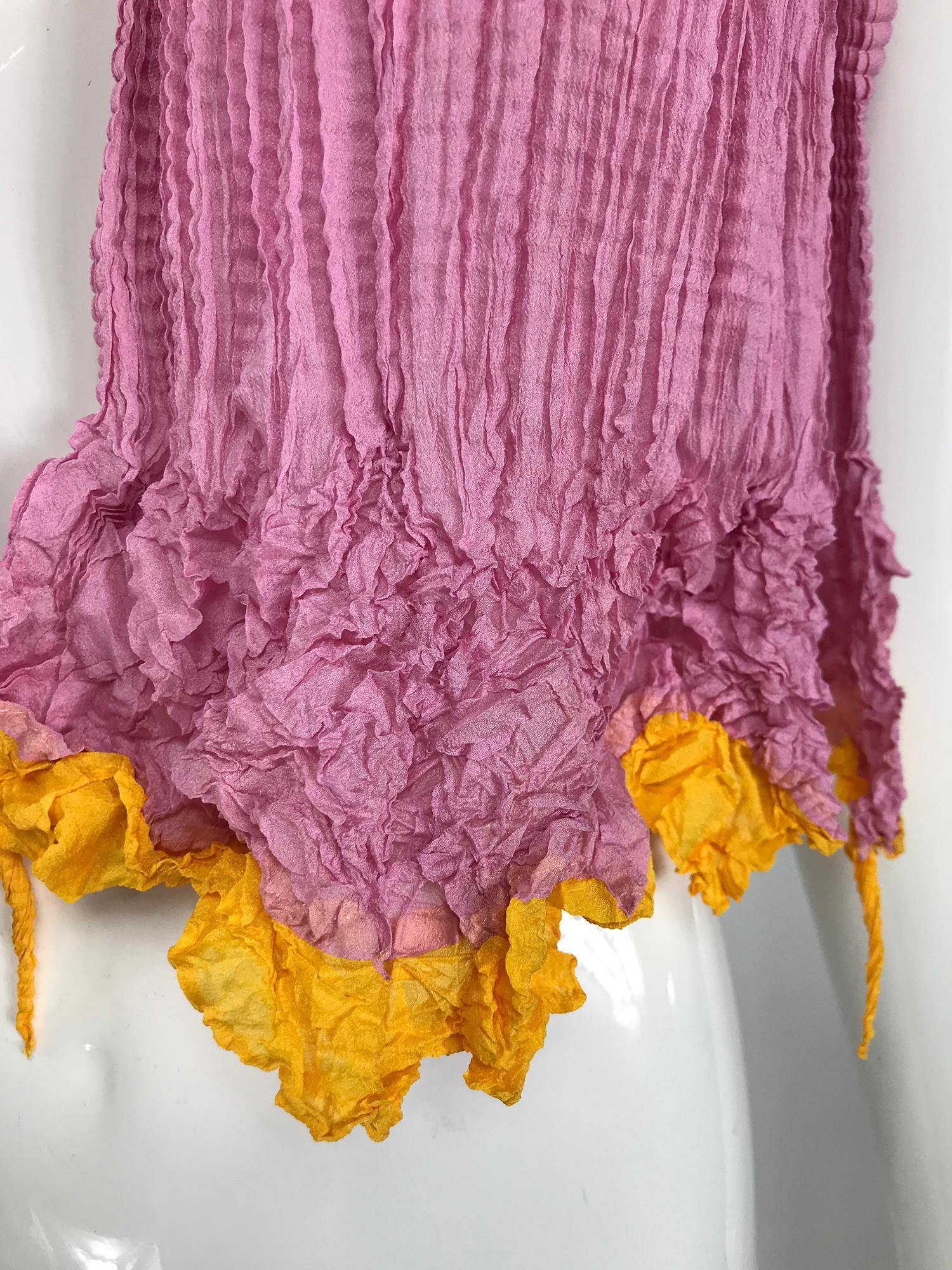 Issey Miyake shibori scarf in bubblegum pink and egg yoke yellow. This is such a great scarf, the colours are very happy. The scarf is crimp pleated, the ends are shape crimped and are very flower-like. In excellent condition, looks