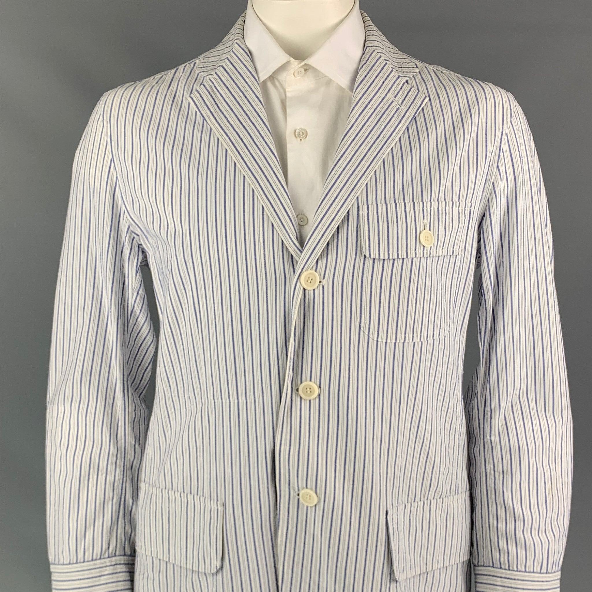 ISSEY MIYAKE sport coat comes in a white & blue stripe cotton featuring a notch lapel, patch pockets, and a three button closure. Made in Japan.Good
Pre-Owned Condition. Moderate discoloration at collar. 

Marked:   JP 4 

Measurements: 
 
Shoulder: