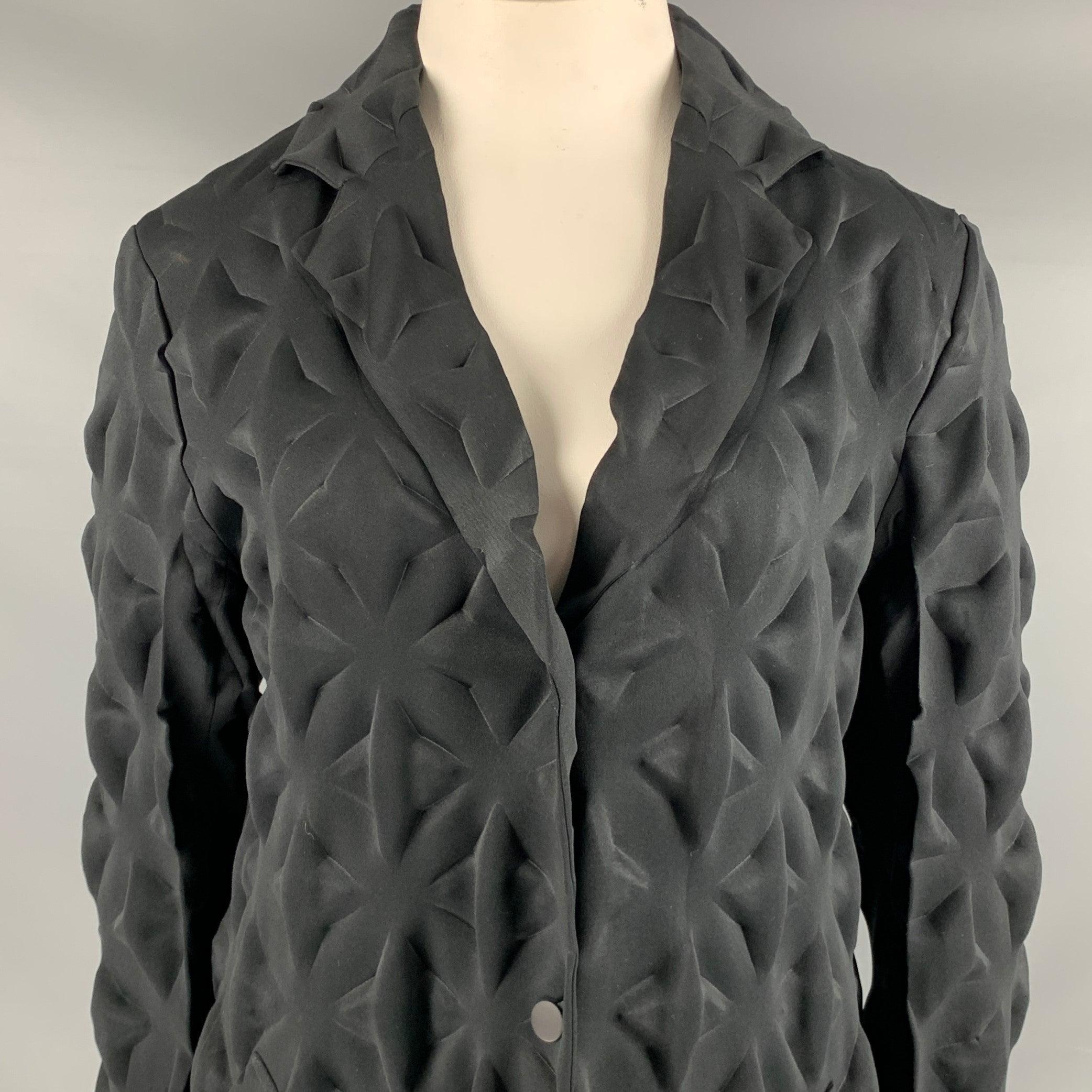 ISSEY MIYAKE coat
in a black polyester fabric featuring dramatic long length, stunning embossed star pattern, and snap closure. Made in Japan.Very Good Pre-Owned Condition. Minor marks. 

Marked:   JP 4 

Measurements: 
 
Shoulder: 17 inches Bust: