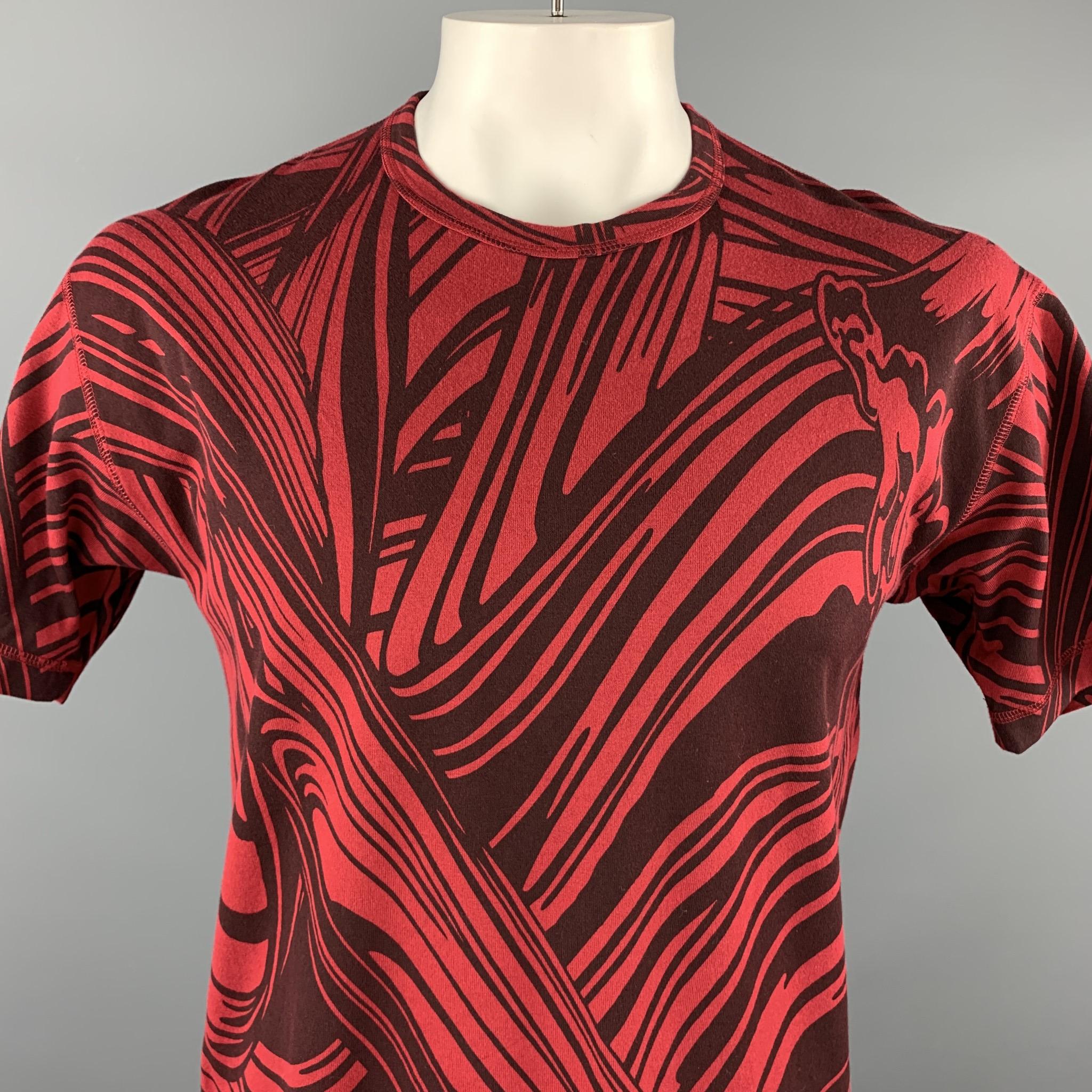ISSEY MIYAKE MEN T shirt comes in red cotton jersey with an all over abstract burgundy brush stroke print. Tags removed. As-is.

Very Good Pre-Owned Condition.
Marked: (no size)

Measurements:

Shoulder: 21 in.
Chest: 44 in.
Sleeve: 9 in.
Length: 27