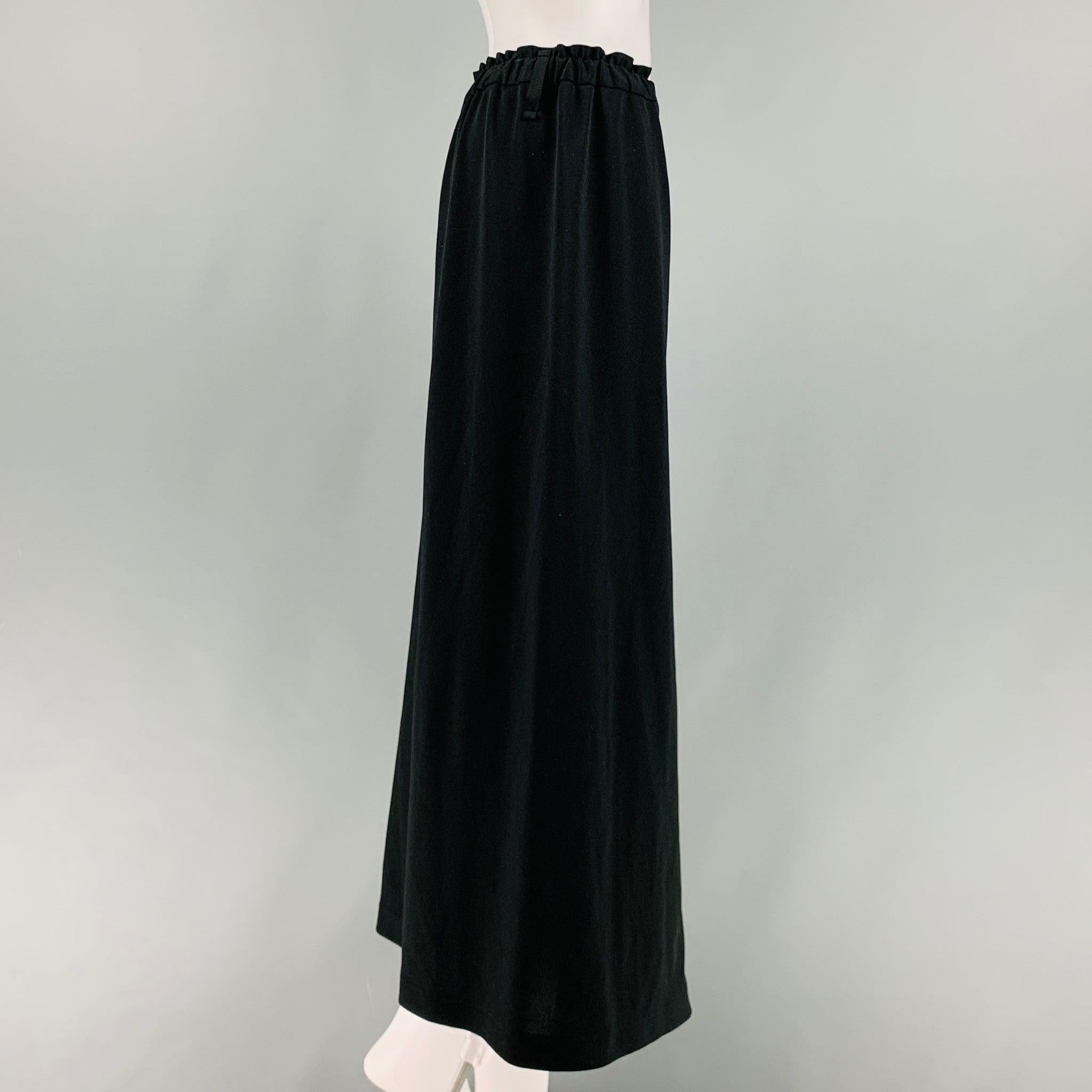 ISSEY MIYAKE casual pants comes in a black jersey knit featuring a drop-crotch style, skirt style pant 132 5, elastic waistband, and a button fly closure. Made in Japan.Excellent Pre-Owned Condition.  

Marked:   2 

Measurements: 
  Waist: 29