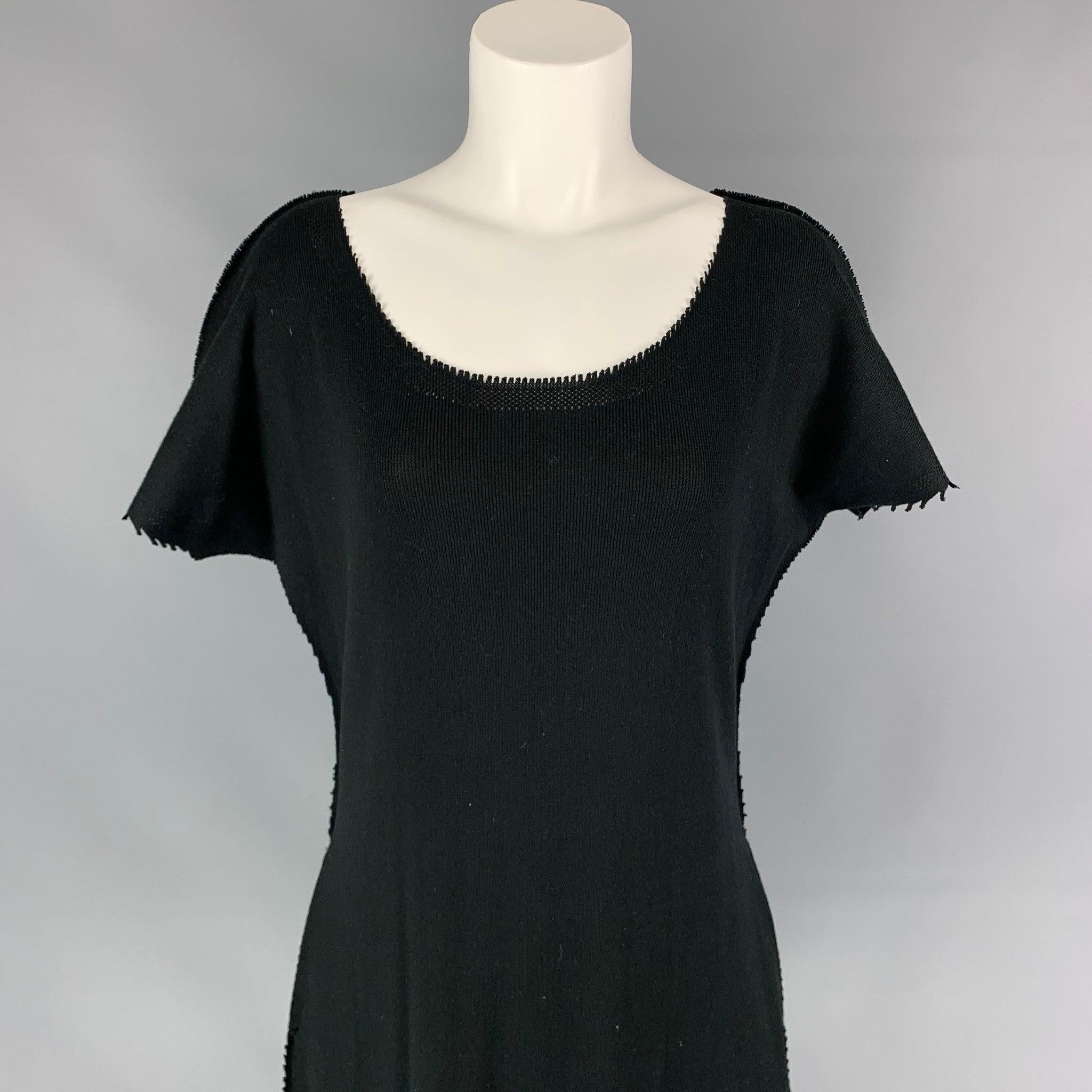 ISSEY MIYAKE dress comes in a black knitted material featuring a shift style, raw edges, slit pockets, and a loose neckline. Made in Japan.Very Good
Pre-Owned Condition. 

Marked:   JP 2 

Measurements: 
 
Shoulder: 18.5 inches  Bust: 48 inches 