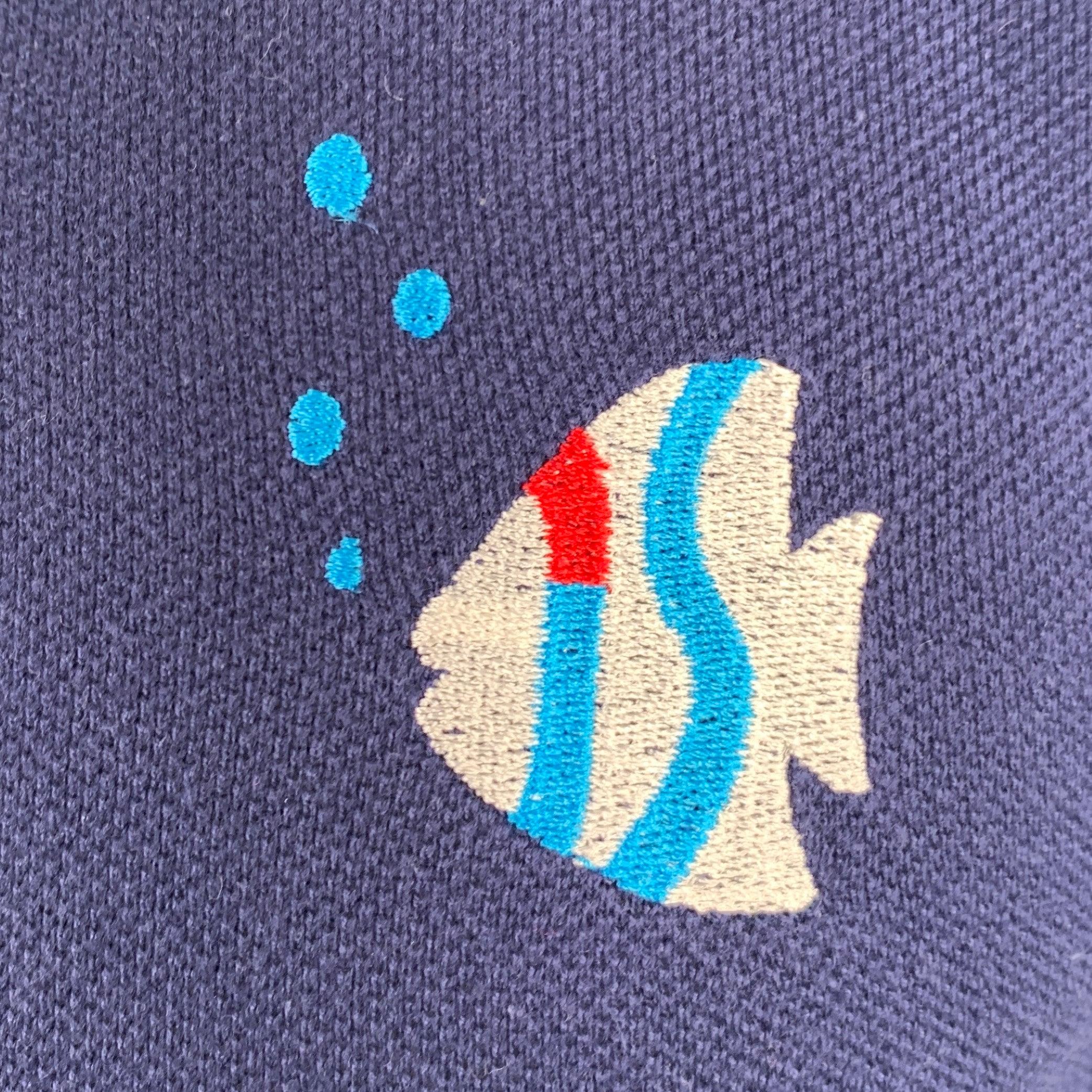Vintage ISSEY SPORT by ISSEY MIYAKE polo
in a navy cotton jersey featuring embroidered fish, long sleeves, and half placket button closure.Excellent Pre-Owned Condition. 

Marked:   M 

Measurements: 
 
Shoulder: 18.5 inches Chest: 38 inches Sleeve: