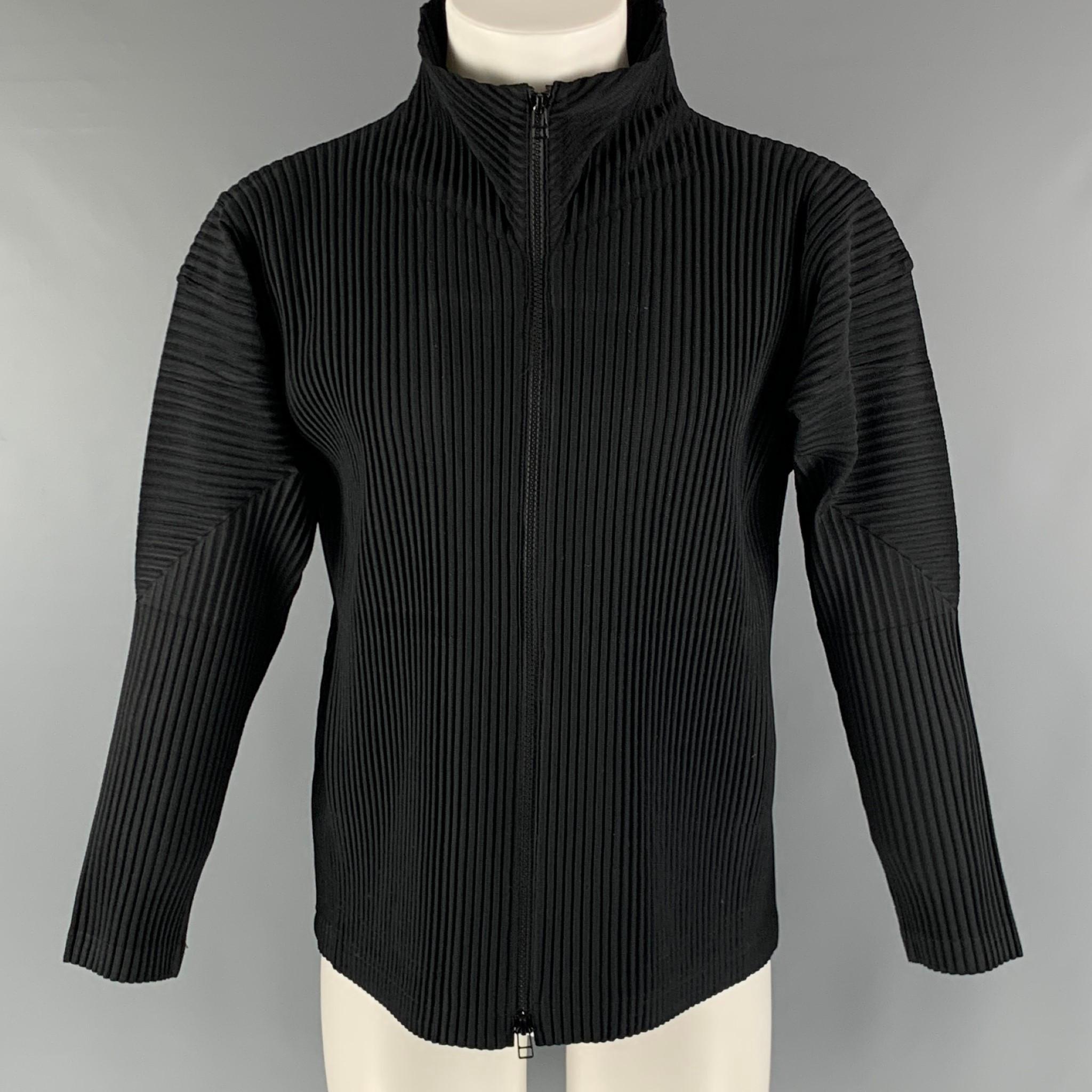 ISSEY MIYAKE ' HOMME PLISSE' jacket comes in a black polyester with a pleated design featuring frontal pockets, and a zip up closure. Made in Japan.

Excellent Pre-Owned Condition.
Marked: JP 2

Measurements:

Shoulder: 18 in.
Bust: 45 in. 
Sleeve: