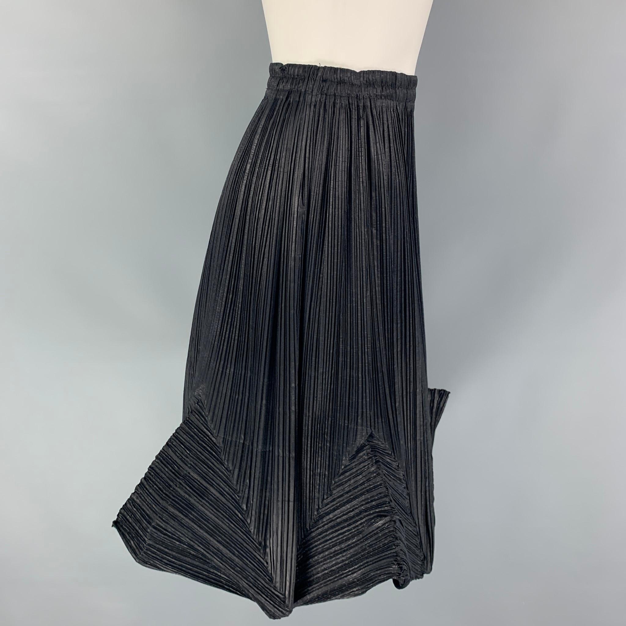 ISSEY MIYAKE skirt comes in a black polyester / silk featuring a 3D pleated design, midi, and a elastic waistband. Made in Japan. 

Very Good Pre-Owned Condition.
Marked: S

Measurements:

Waist: 26 in.
Hip: 36 in.
Length: 21 in.