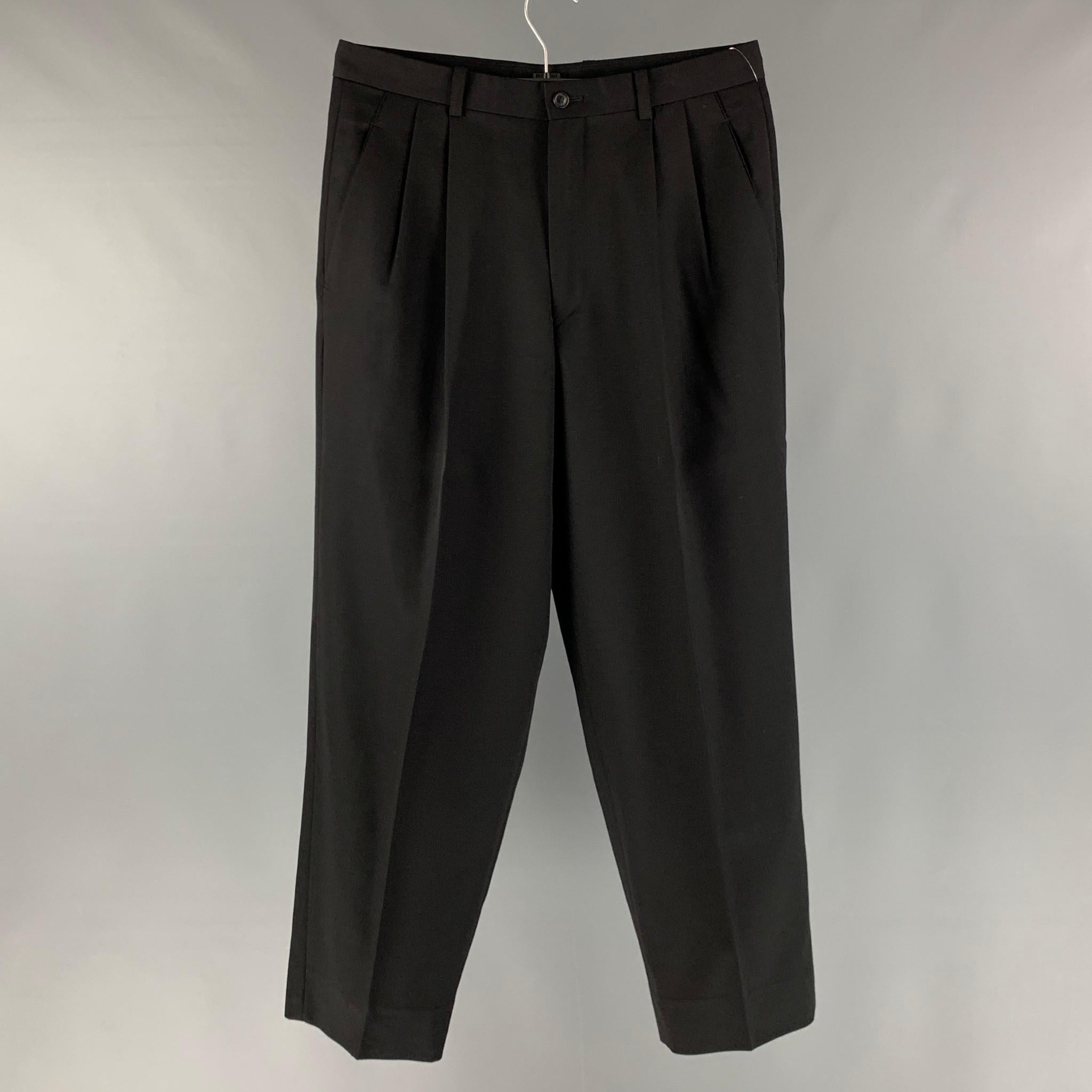 ISSEY MIYAKE dress pants comes in a black wool featuring a pleated style, and a zip fly closure. Made in Japan.

Excellent Pre-Owned Condition.
Marked: S

Measurements:

Waist: 32 in.
Rise: 12 in.
Inseam: 29 in.
Leg Opening: 18 in. 

SKU: