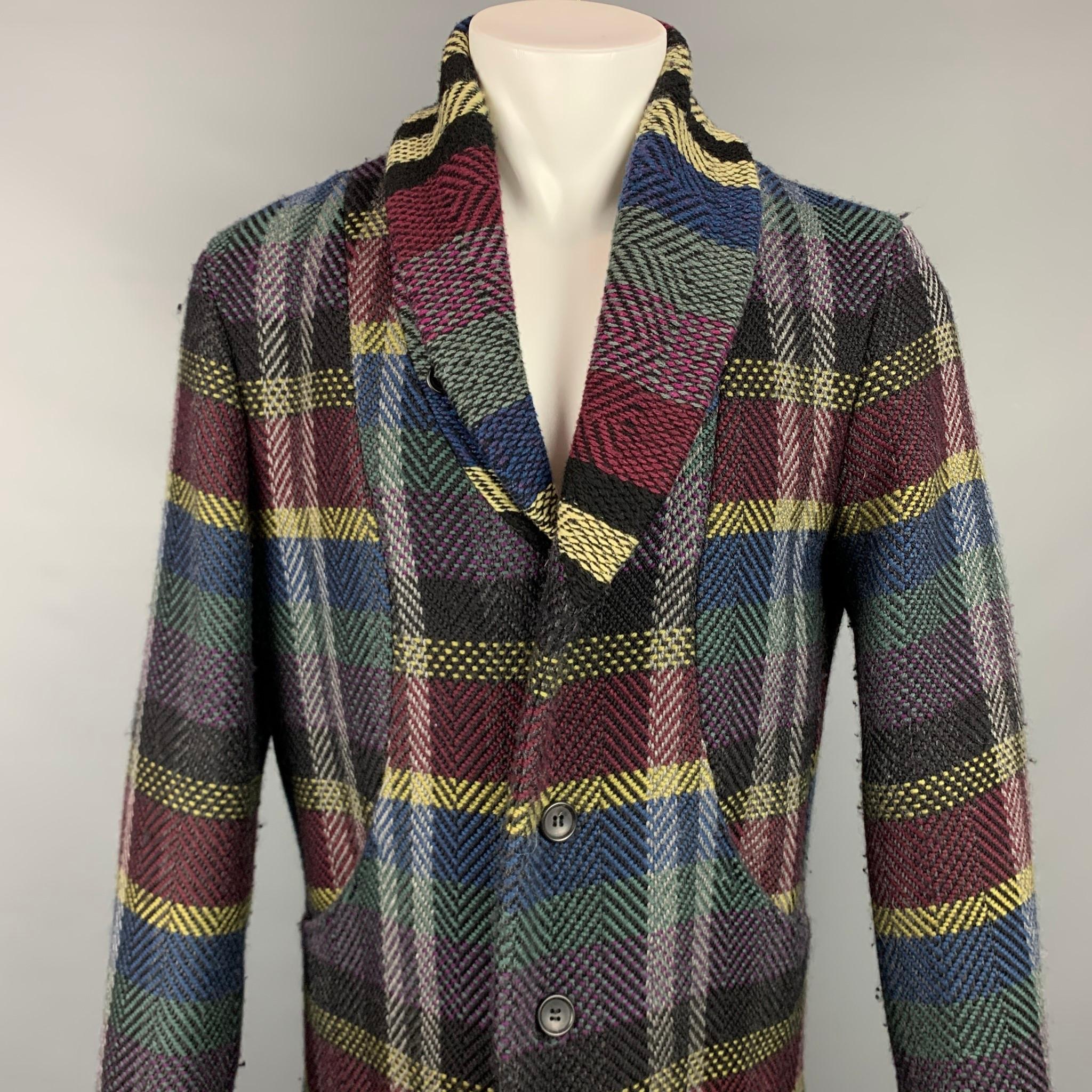 ISSEY MIYAKE coat comes in a multi-color plaid material with a full liner featuring a shawl collar, two large pockets, and a buttoned closure.  Retail $2000

Very Good Pre-Owned Condition.
Marked: 2

Measurements:

Shoulder: 19 in.
Chest: 44