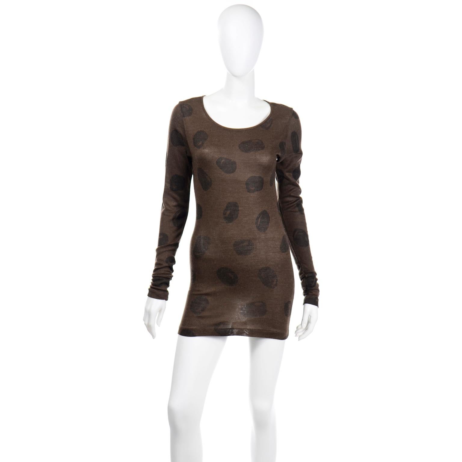 This really fun, 1980's vintage Issey Miyake piece can be worn as a bodycon mini dress or as a longer top!  The fabric is 90% acrylic and 10% wool and the mushroom brown background is printed with abstract dark brown dots or circles. Labeled a size