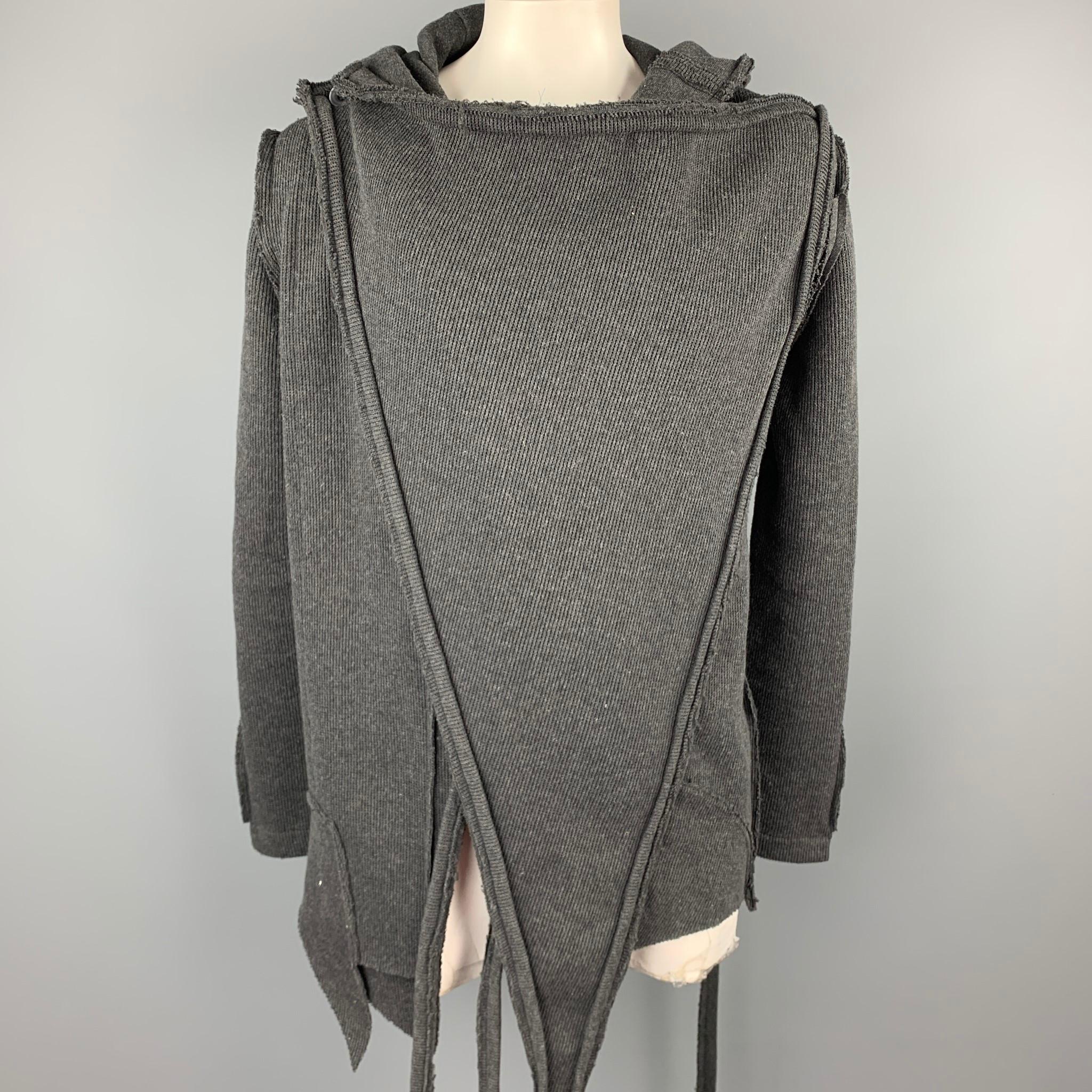 ISSI coat comes in a charcoal ribbed cotton featuring an asymmetrical design, raw hem, long strap details, hooded, and a button closure.

Very Good Pre-Owned Condition.
Marked: 3

Measurements:

Shoulder: 19 in. 
Chest: 44 in. 
Sleeve: 28 in.