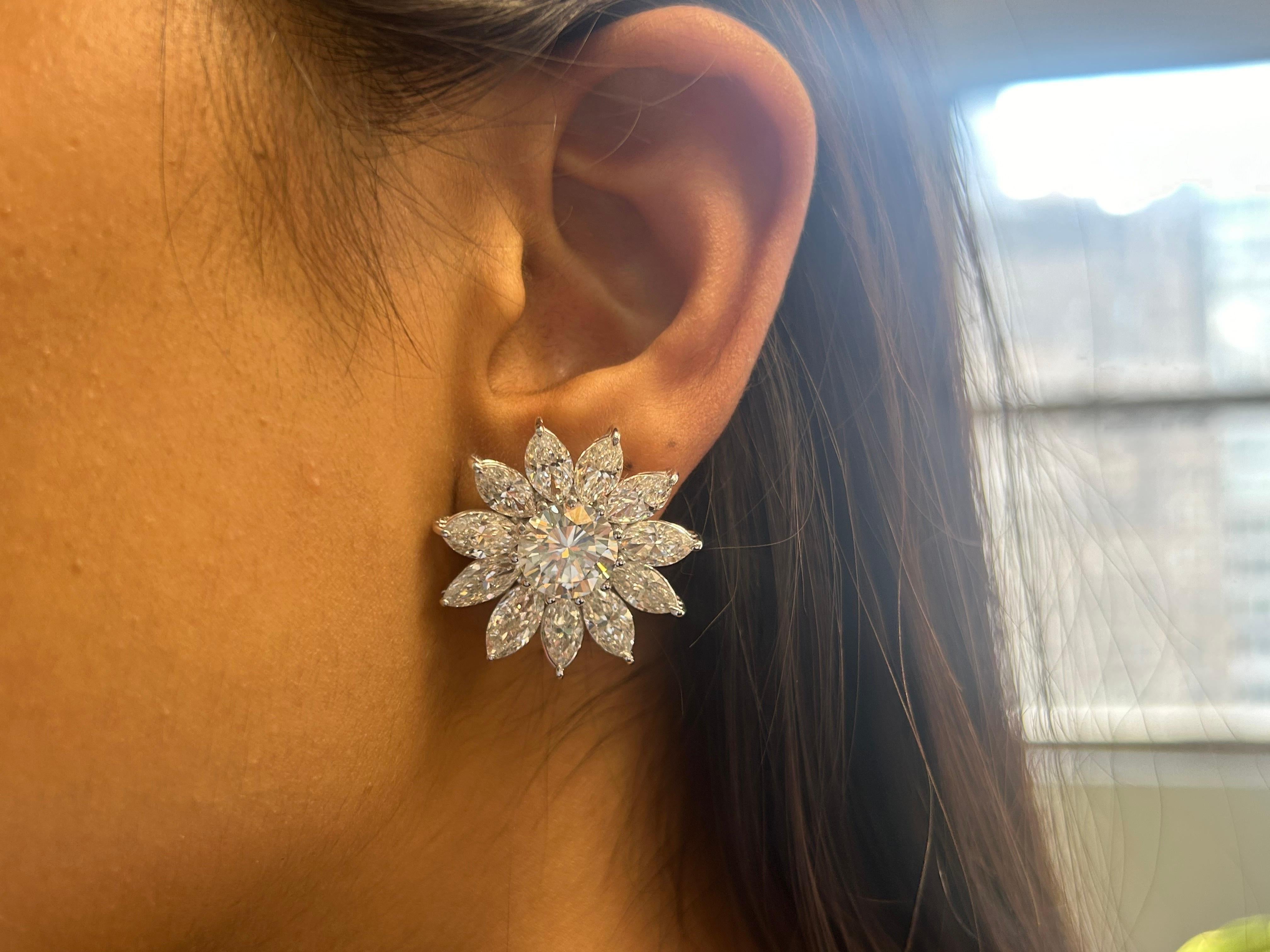 These stunning18K white gold 15.62 carat total weight Daisy marquise diamond earrings are crafted to dazzle. The earrings feature a striking flower design with a radiant round diamond center (3.12 and 3.20 carat each) which are E-F color and VS1