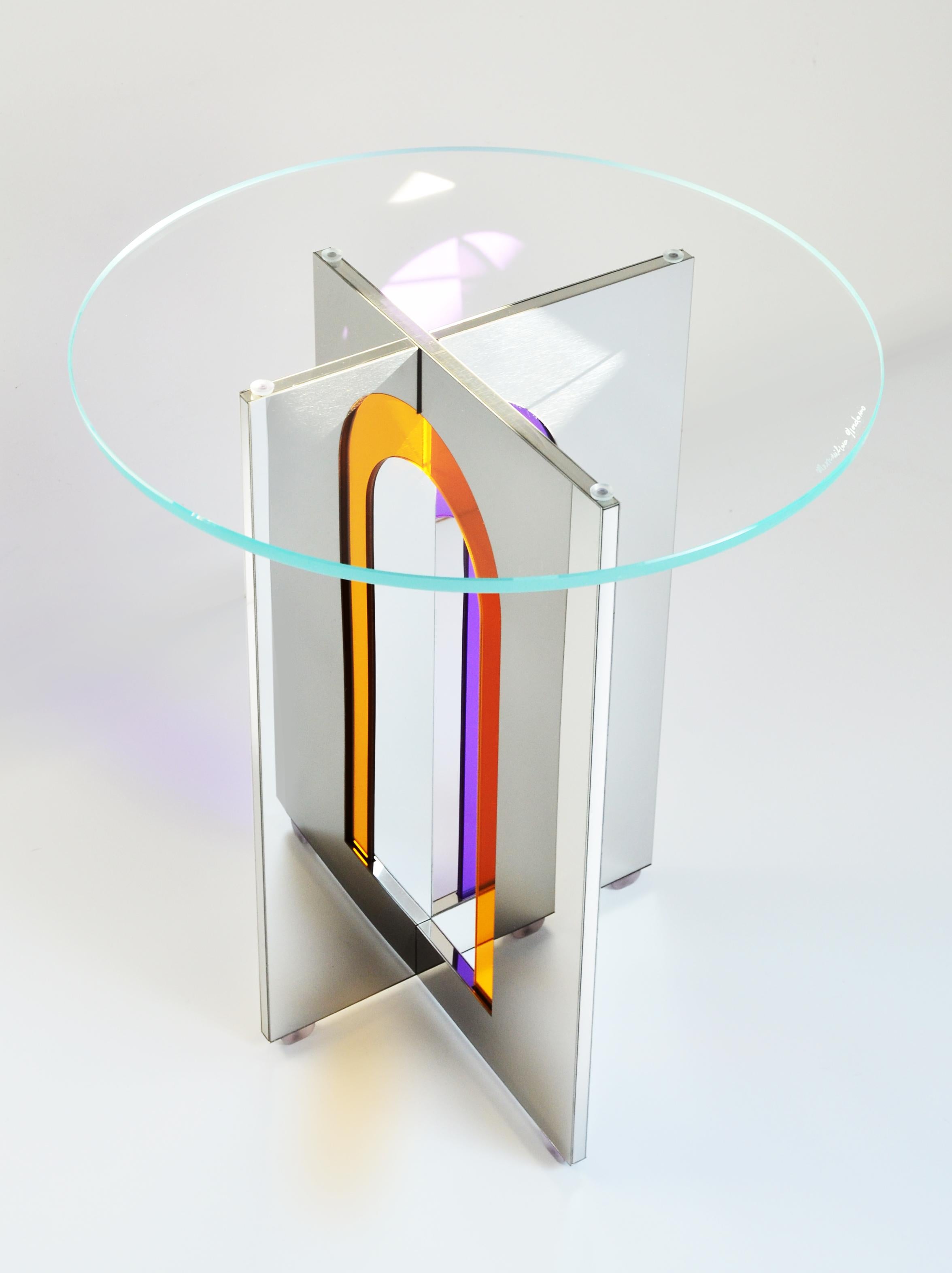 Itaca 45 Side Table by Atlas Project
Dimensions: Ø 45 x H 50 cm. 
Materials: Stainless mirror steel and glass.

Available in different sizes. Please contact us.

Itaca Coffee Tables
A door that leads to infinite others. The geometries of the Itaca