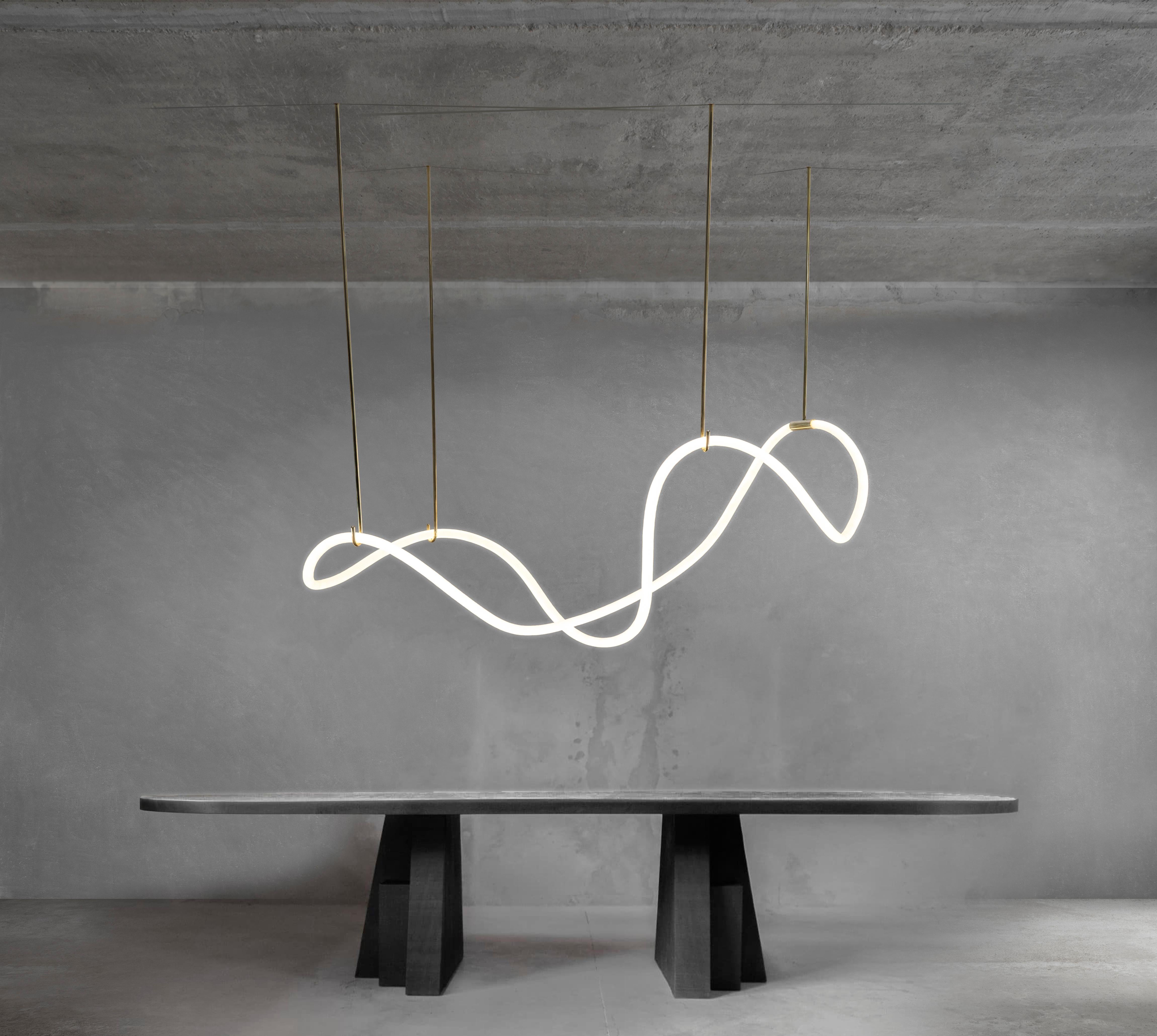 Itaca, sculptural brass circular light pendant by Morghen Studio
Materials: Polished brass, LED light
Dimensions: 150 x 100 x 130 H cm (variable)
Light source: 5m LED neon - 32 w - 3.000 k - 3.800 lm
Driver: External ED (24 volts - 50 watt - 3000 k