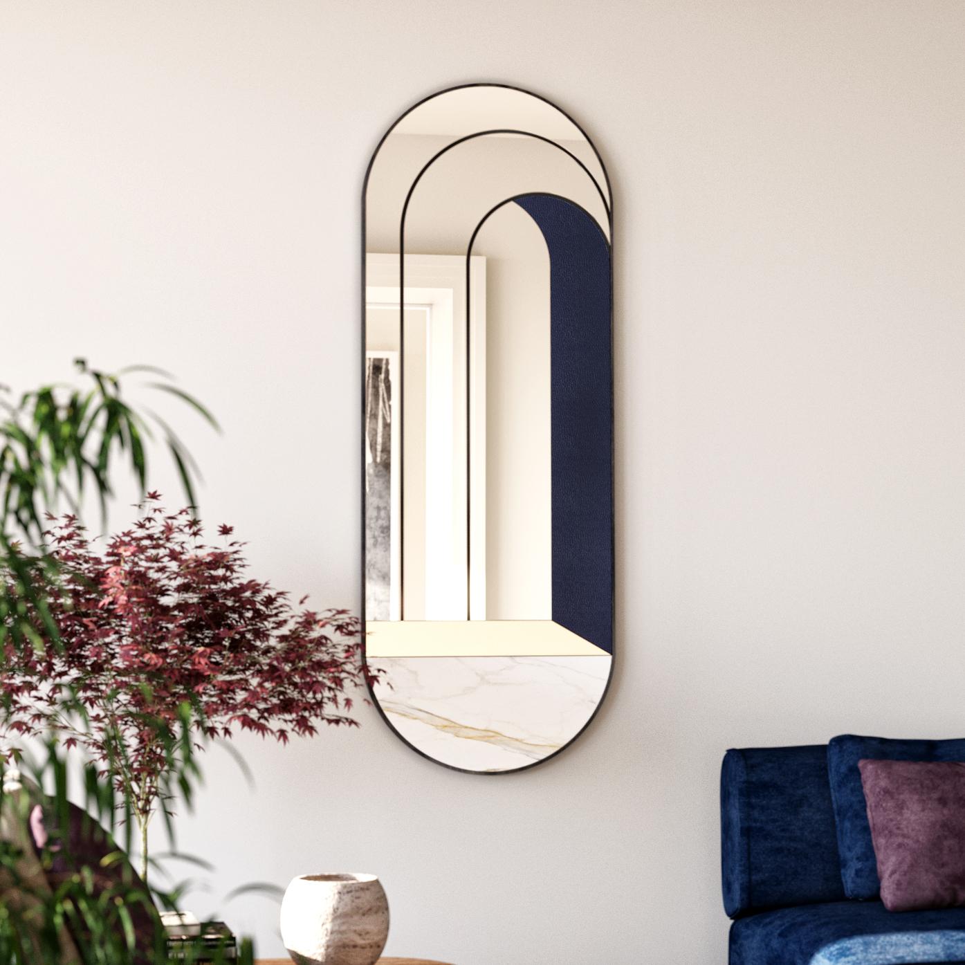 Specchio da parete Itaca di Atlas Project
Dimensioni: P 3 x L 58 x H 157 cm. 
Materiali: Ferro verniciato a polvere nero, marmo Calacatta Gold, ottone spazzolato, specchio, pelle blu e legno. 

ITACA
A door that leads to infinite others. Le