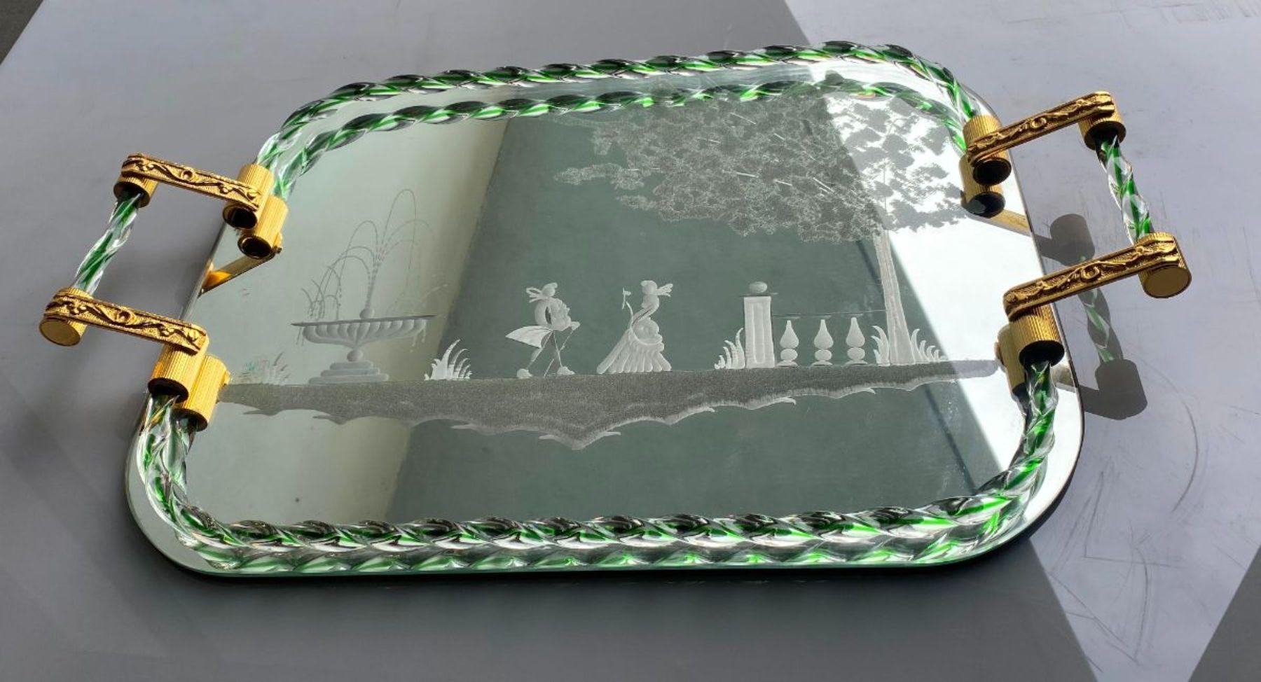 Mid-century mirror-engraved Murano glass serving tray. This wonderful piece was produced in Italy during 1940s. The mirror has romantic Venetian characters and a picturesque countryside landscape. Iconic vanity tray with handles; the rectangular top