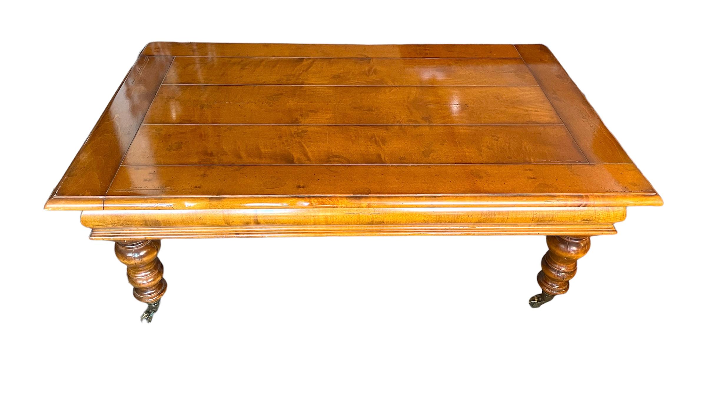 Itailian maple coffee table by Milling Road for Baker Furniture on wheels that function well, solid and aged gracefully- see photos for soft glass rings  but blend in the age of the table quite well.