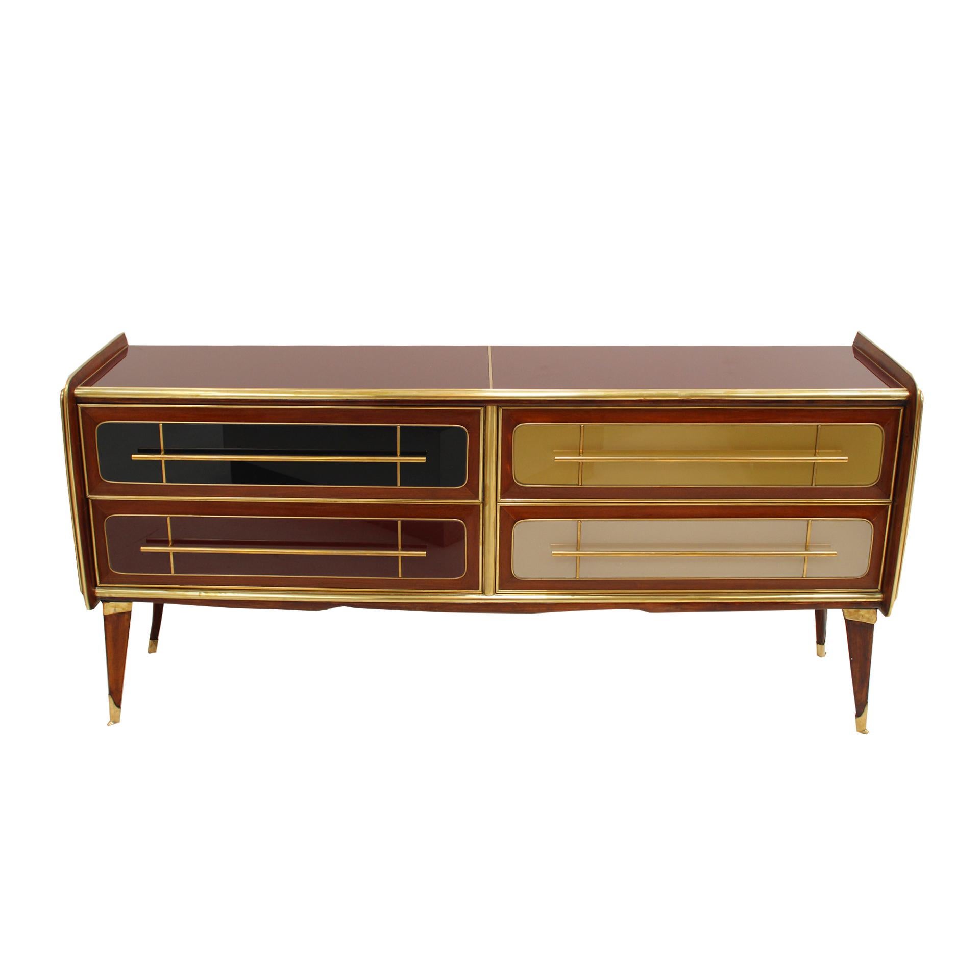 Stunning mid-century Italian sideboard with a striking design from the 1950s. This exquisite piece features a solid wood structure, elegantly covered with colored glass panels that bring a vibrant and sophisticated touch to any interior. With 4