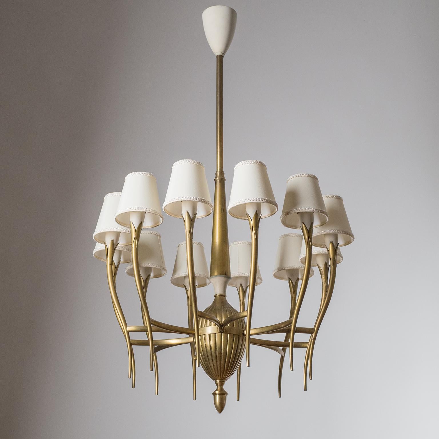 Rare Italian brass chandelier from the 1930-1940s. 12 sensuously curved satin brass arms with off-white lacquered socket covers - each with an original brass E14 socket with new wiring and shades.