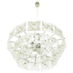 Italian 12 Lights 1970s Chandelier in Faceted Glass and Chromed Plated Metal