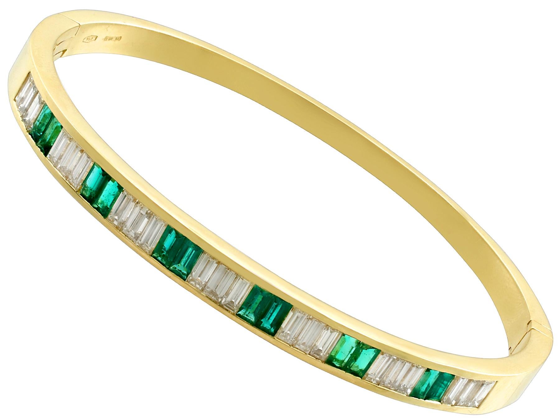 A fine and impressive contemporary Italian 2.31 carat diamond and 1.35 carat emerald, 18 carat yellow gold bangle; part of our diverse contemporary jewellery collections.

This fine and impressive emerald and diamond bangle has been crafted in 18k