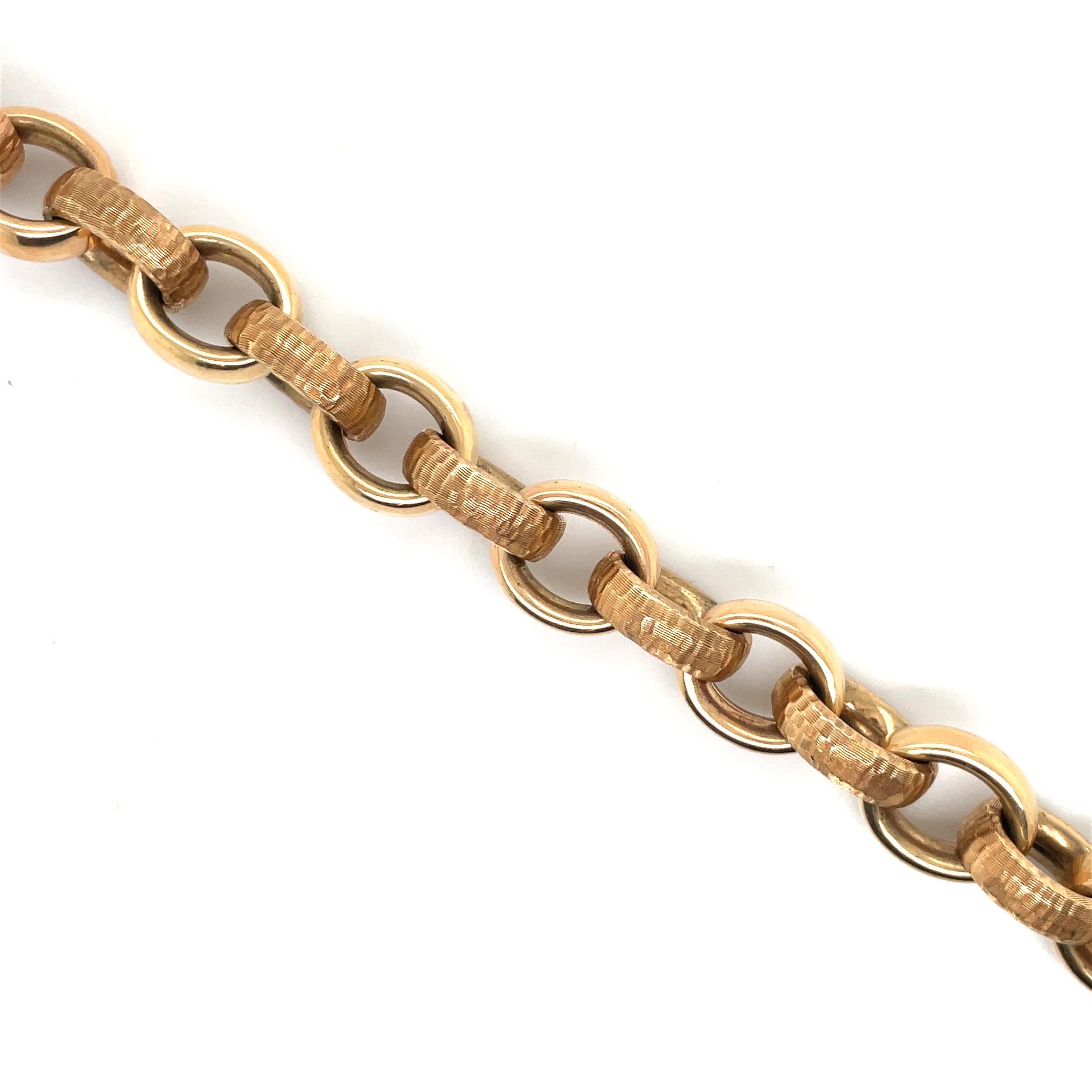 Made in Italy, this 14 Karat Rose Gold bracelet features alternating high polished & hammered motif links weighing 36.6 Grams.
