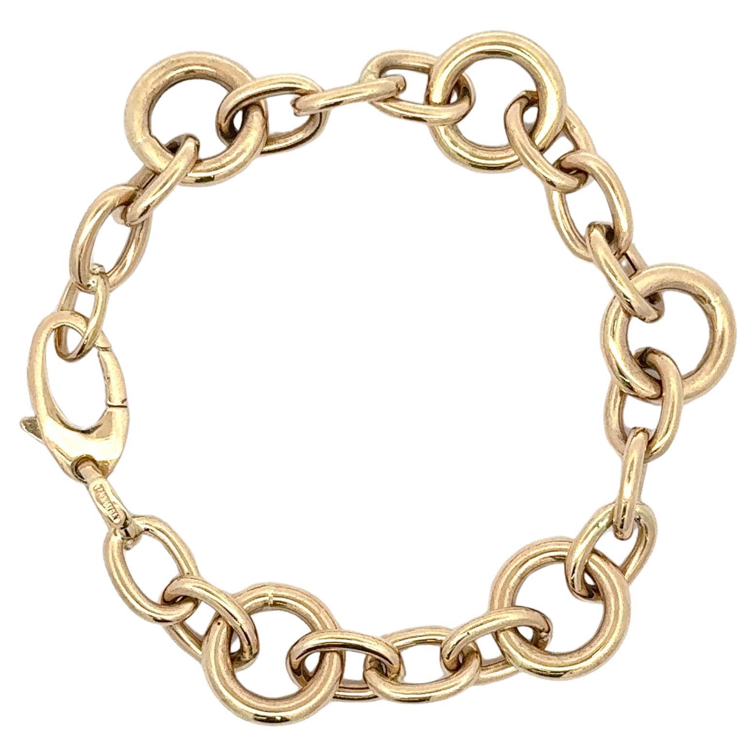 Bracelet italien en or jaune 14 carats composé de trois maillons ovales et d'un grand maillon rond pesant 9,6 grammes. 
Maillon rond : 13,4 mm
Ovale : 11 mm x 8 mm