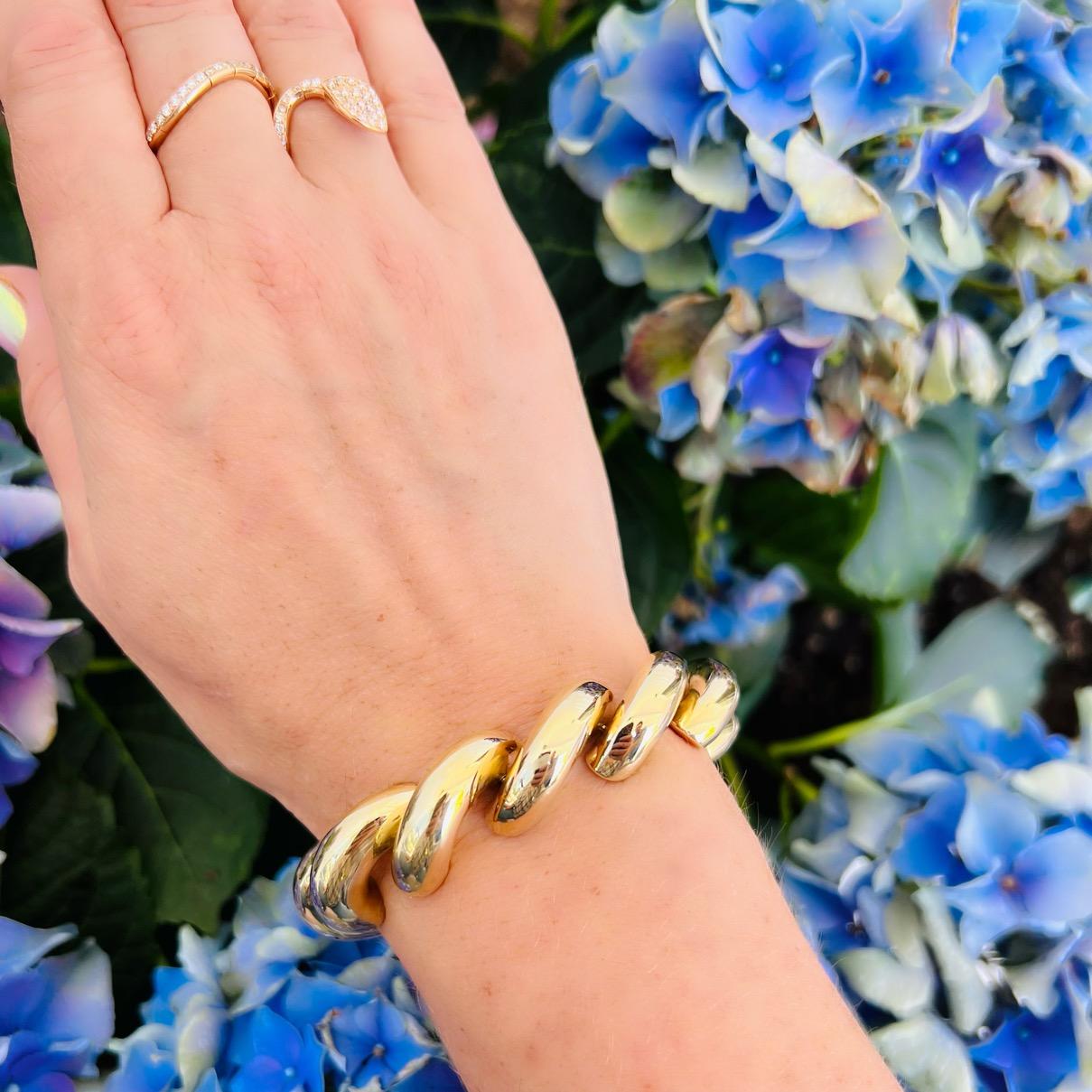 Bring on the 70's! Fun to wear and bold in style, a San Marco bracelet was THE statement piece for your wrist of the era. It's a must have! The heavy, hollow form bracelet weighs 55 grams, and measures 7 1/4 in. long and 1/2in. wide. A beautifully