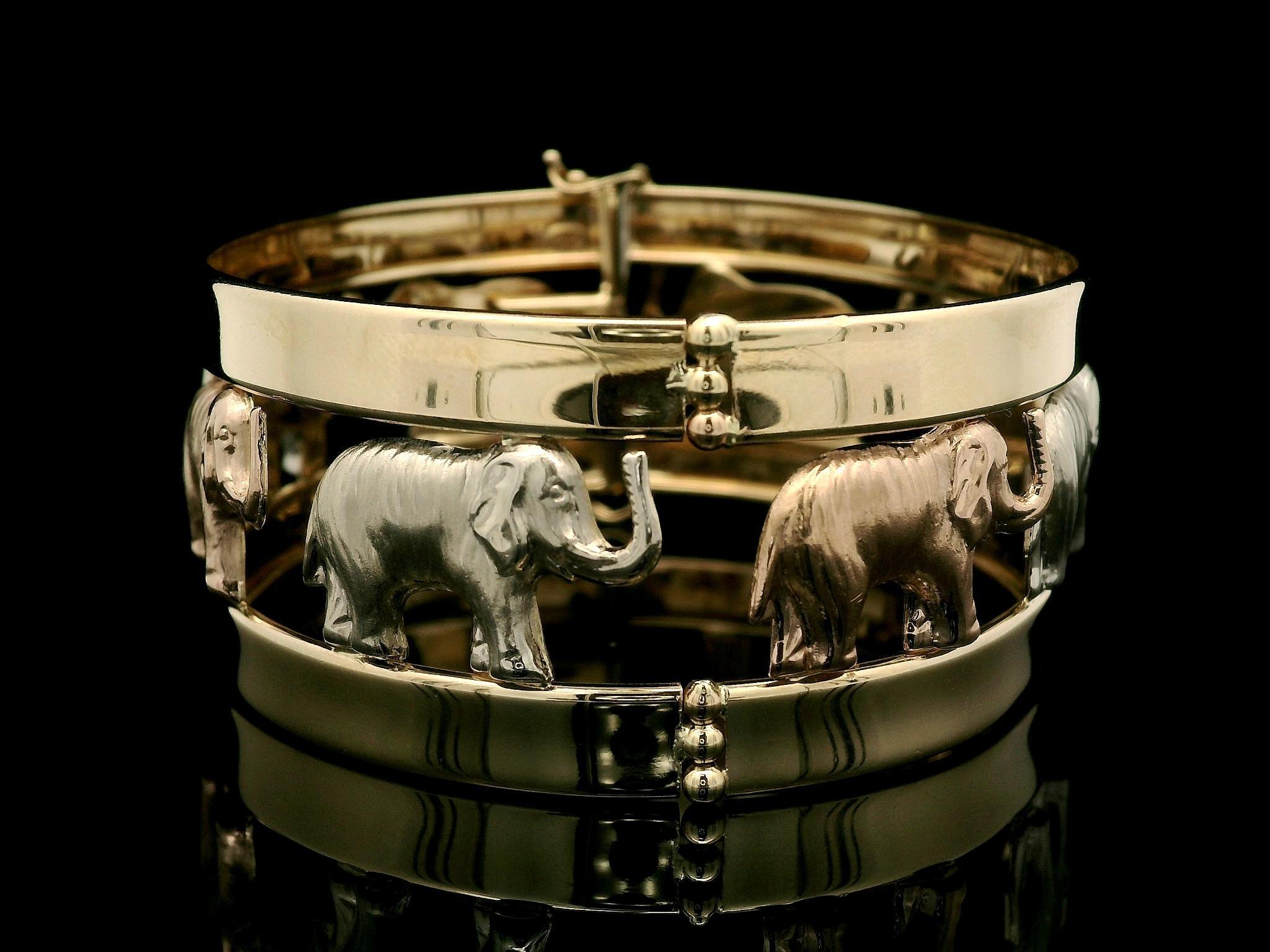 Material: Solid 14k Yellow & White Gold w/ Rose Gold Accents
Weight: 30.43 Grams
Type: Hinged Open Bangle Bracelet
Length: Will fit up to a 7