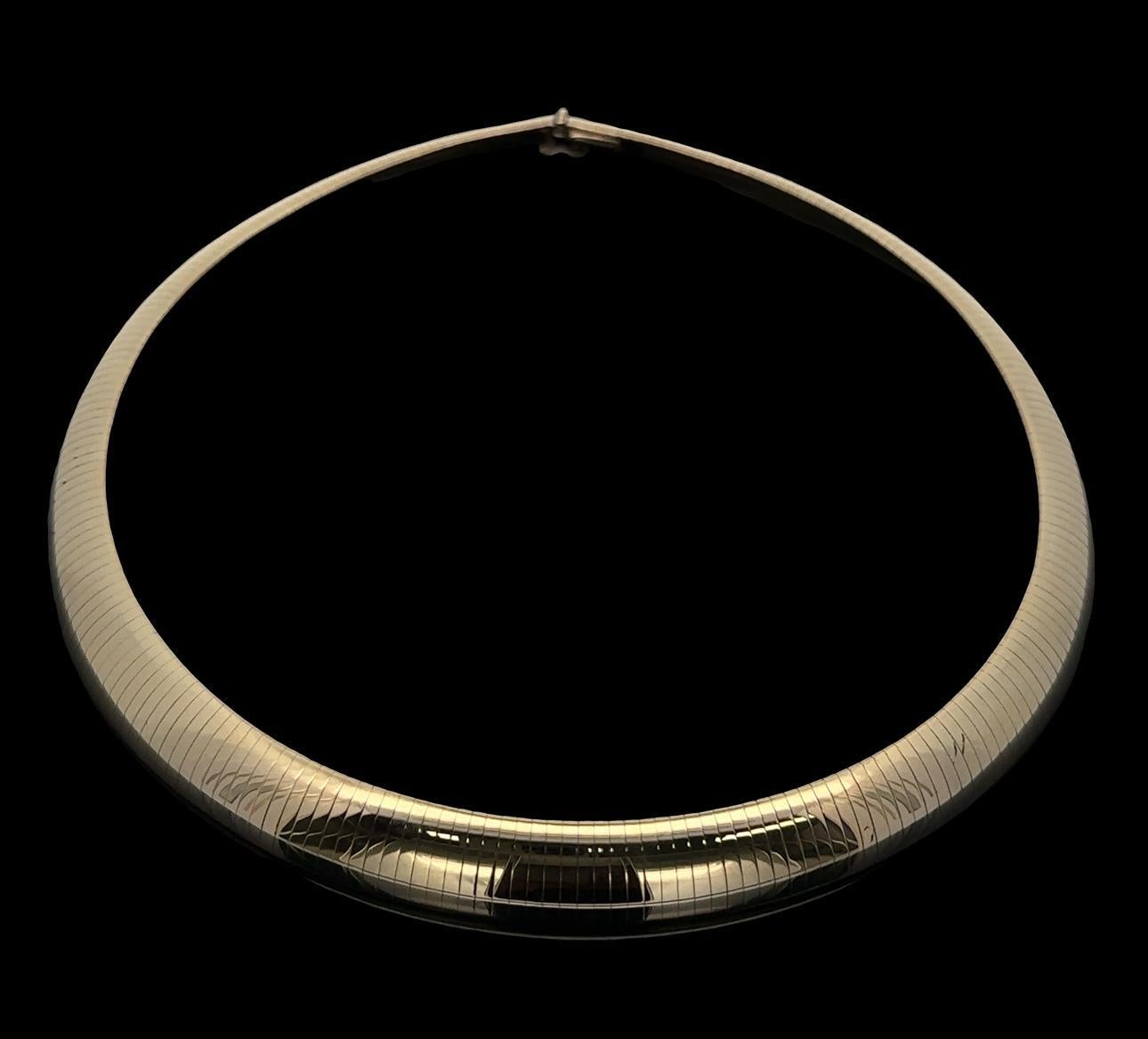 Material: Solid 14k Yellow Gold
Weight: 72.80 Grams
Chain Type: Domed Omega - Push clasp with safety latch
Overall Length: 16.0” (measured on a neck)
Overall Width: 11.7mm (0.46