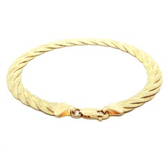 Pulsera italiana de oro amarillo de 14k con textura trenzada y eslabones planos en espiga
