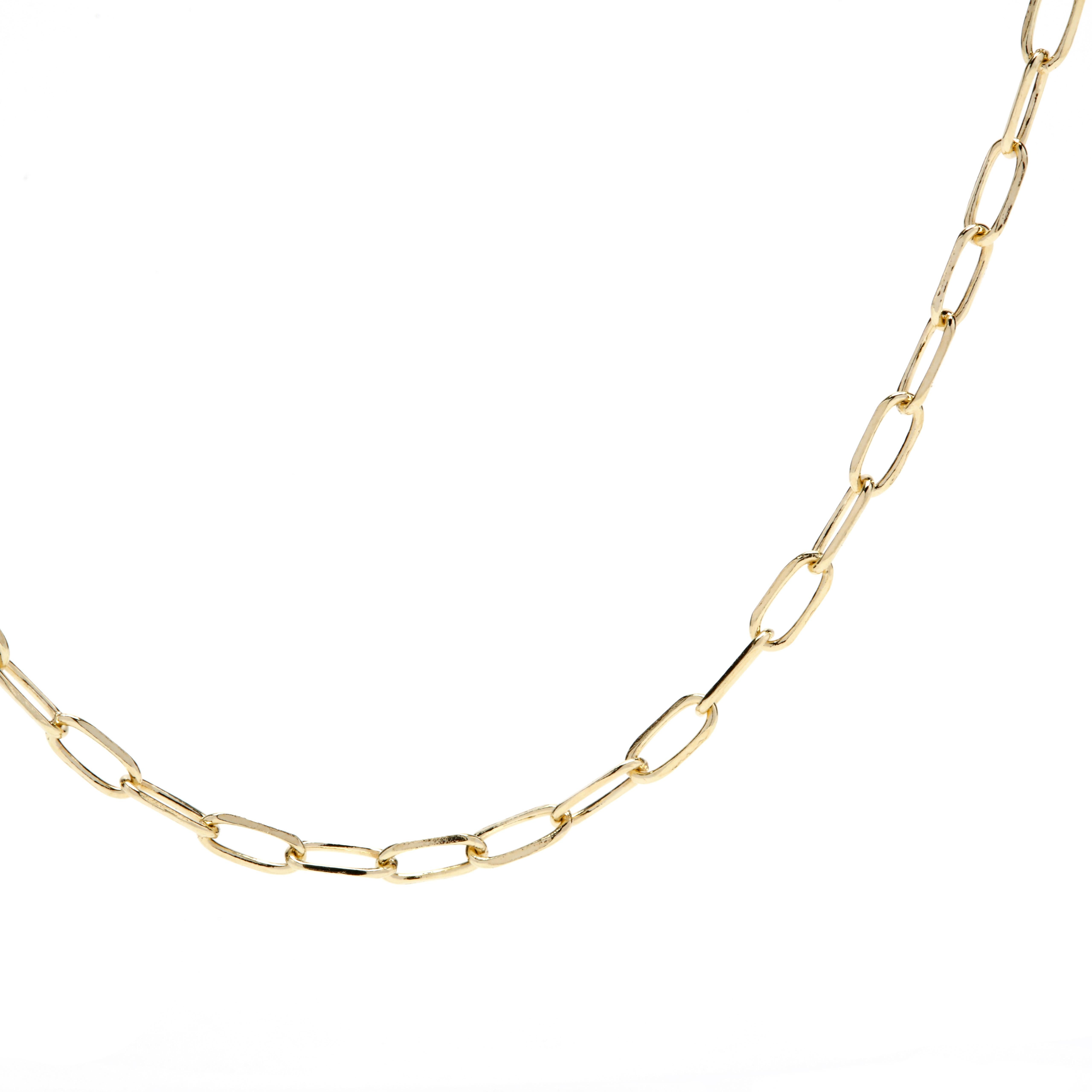 A petite and luxurious Italian 14 karat yellow gold paper clip chain necklace. This gold chain showcases a dainty and delicate elongated oval design with a lobster clasp.  A great addition for everyday or special occasion wear.  Wear this necklace