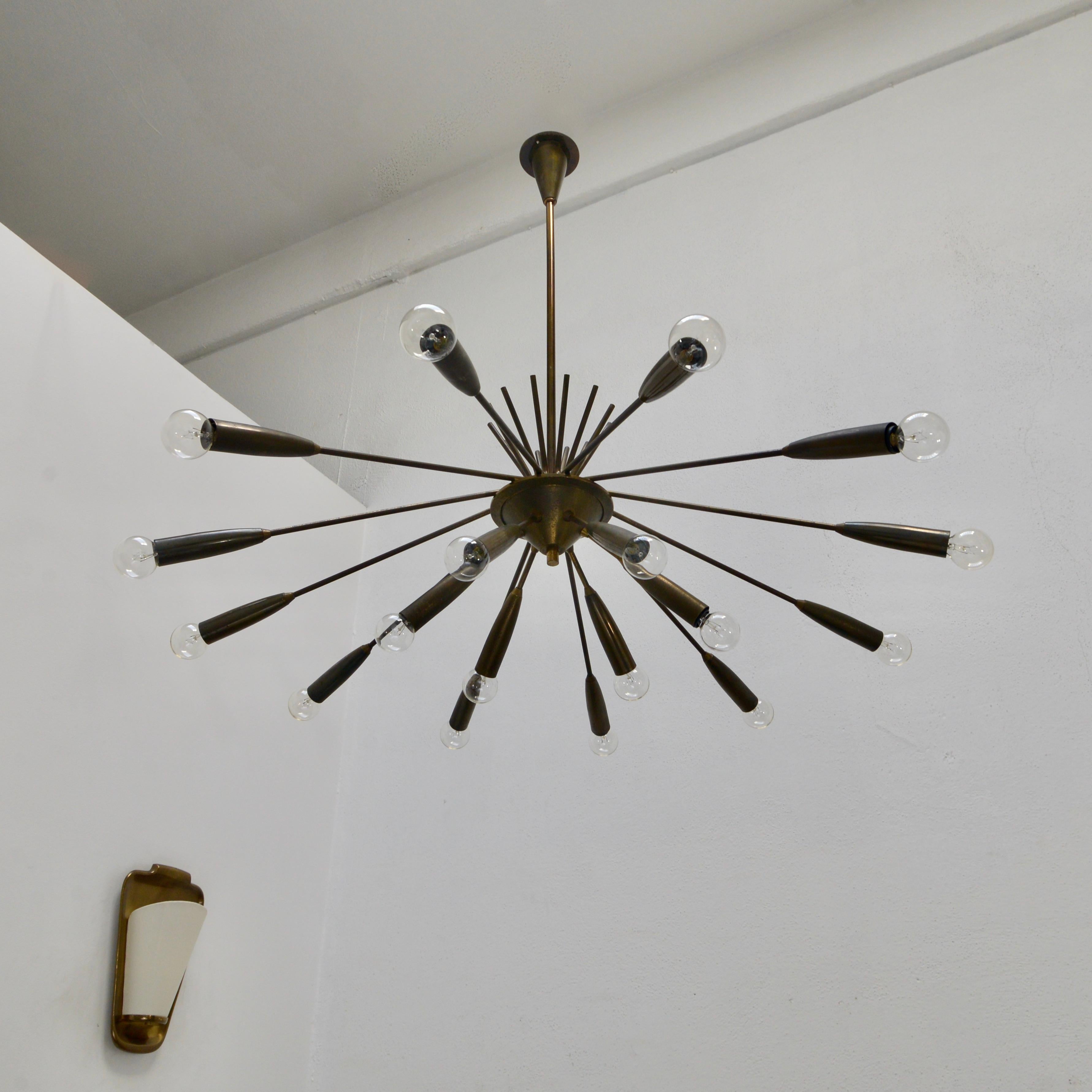 Stunning classical Mid-Century Modern Sputnik chandelier from 1950s, Italy. 16-arm, naturally aged all brass chandelier with original finish. Rewired for use in the USA with 16 E12 candelabra based sockets. Light bulbs included with