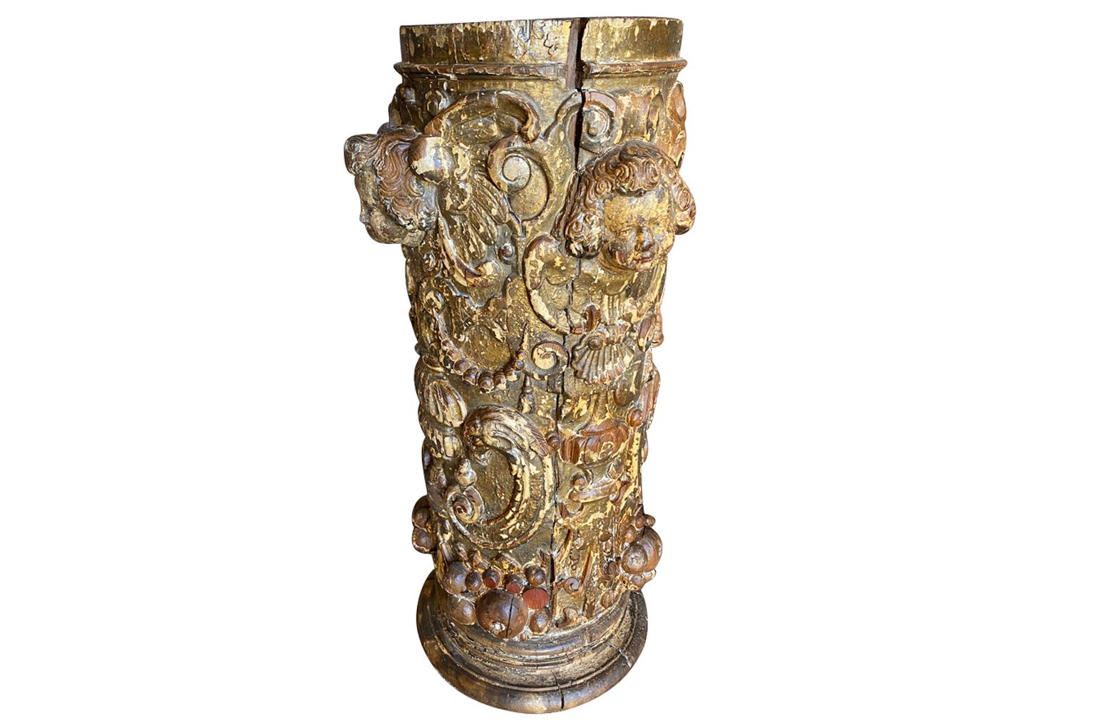 A stunning 16th century Venetian Column - Pedestal. Beautifully crafted from gilt and polychromed wood. Wonderful cavings of putti heads, urns and pomegranates. Sensational patina. Ideal for displaying an urn or sculpture.