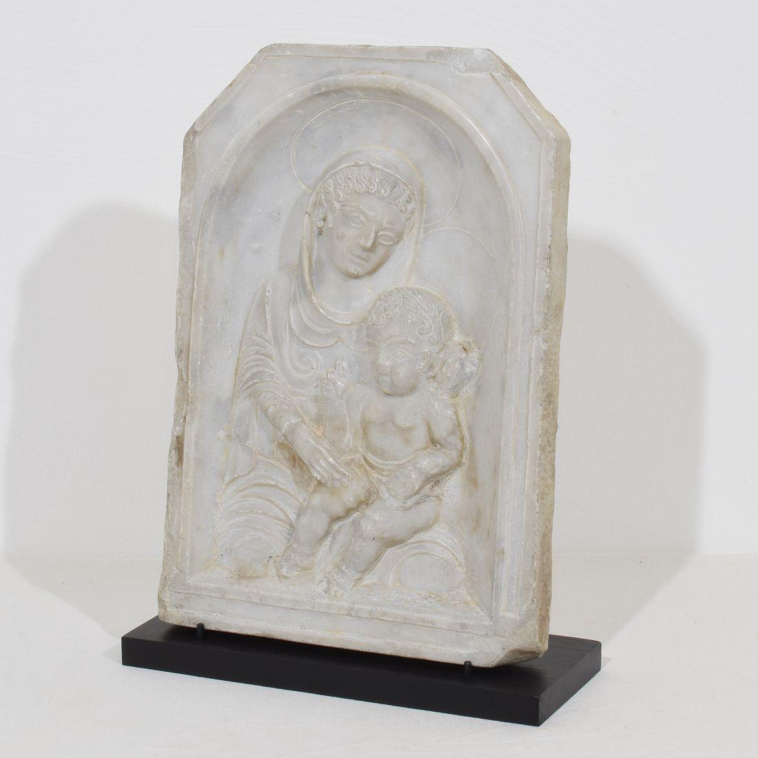 Wonderful 17 century marble panel with a Madonna and child. Gorgeous period piece with great patina.
Italy circa 1650. Weathered and small losses.
Measurement include the wooden pedestal.