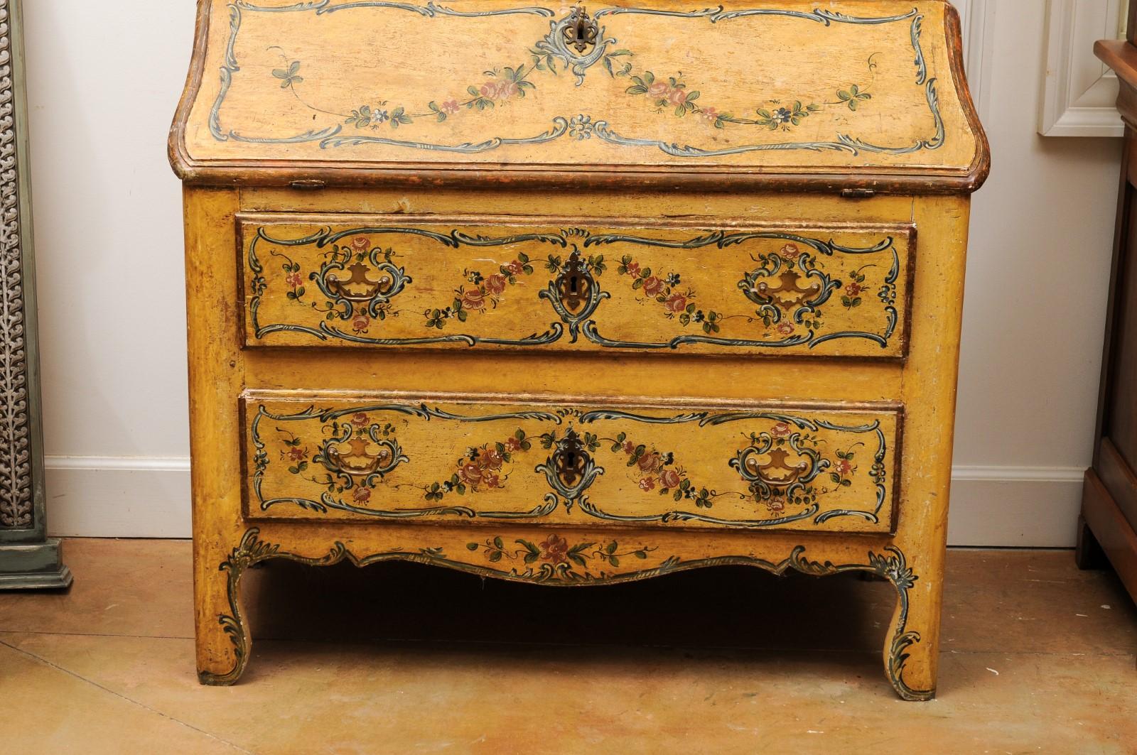 An Italian Rococo period mid-18th century secrétaire from Genoa with hand painted décor and slant-front desk. Created in Northwestern Italy during the third quarter of the 18th century, this tall secrétaire features an arching and molded cornice