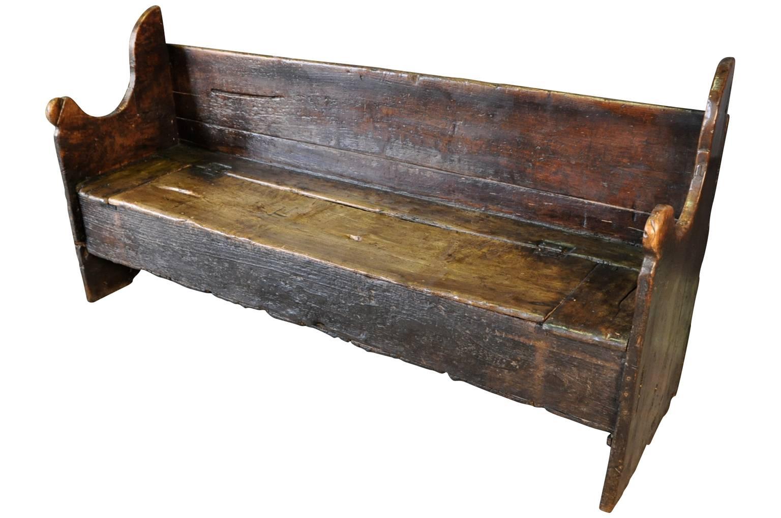 An outstanding 17th century bench from Northern Italy. Soundly constructed from stunning walnut and pine with a trunk space under the seat. Sensational patina - rich and luminous.