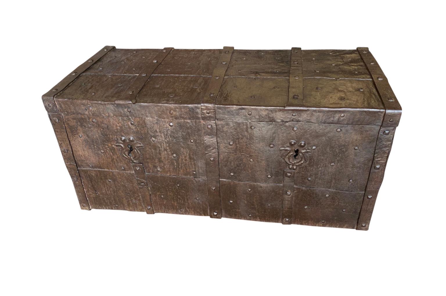 An exceptional 17th century Coffre Forte - Strong Box from the Lombardy area of Italy. Expertly crafted from iron with side handles, iron strapping and nail head detailing. Serves wonderfully as a coffee table with great storage. Excellent patina.