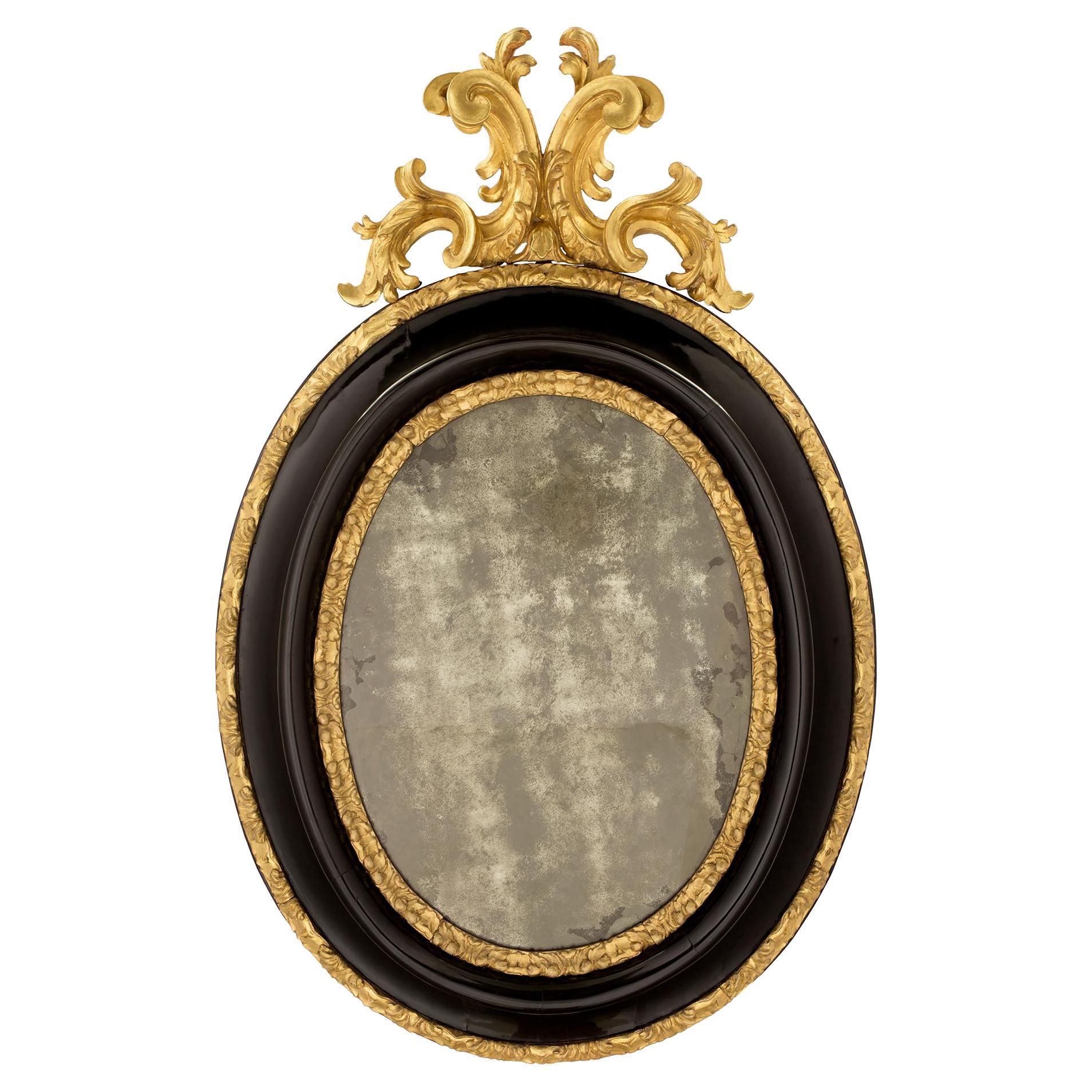 Italian 17th Century Giltwood and Ebonized Fruitwood Florentine Mirror For Sale