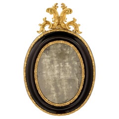Italian 17th Century Giltwood and Ebonized Fruitwood Florentine Mirror