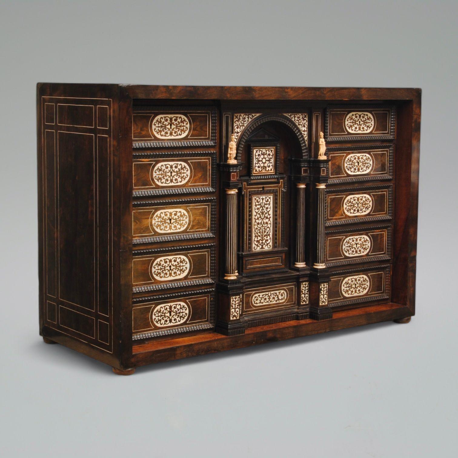 A fine example of an Italian ebony and ivory inlaid table cabinet with double columns flanking the central drawer, all with ripple moulds . This cabinet is similar to the examples from Naples, produced in the second half of the 17th century. It