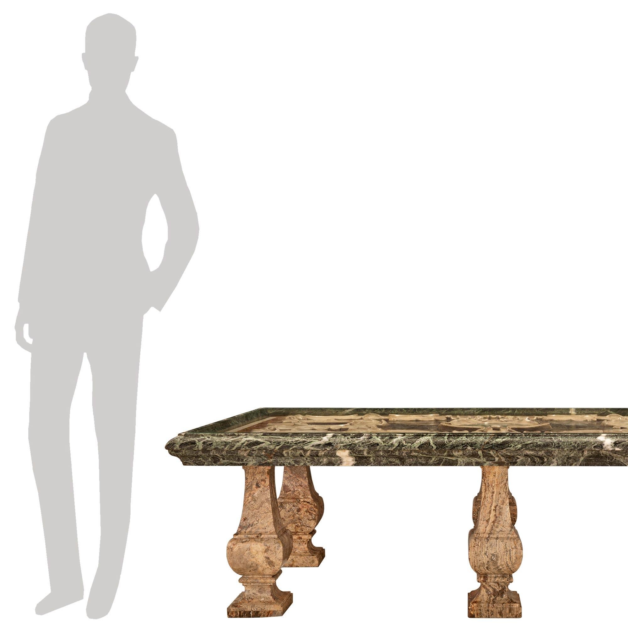 A sensational and extremely decorative Italian 17th century Louis XIV period marble plateau coffee table. The rectangular plateau is raised by striking and impressive 19th century baluster shaped Sarrancolin marble supports with square bases and