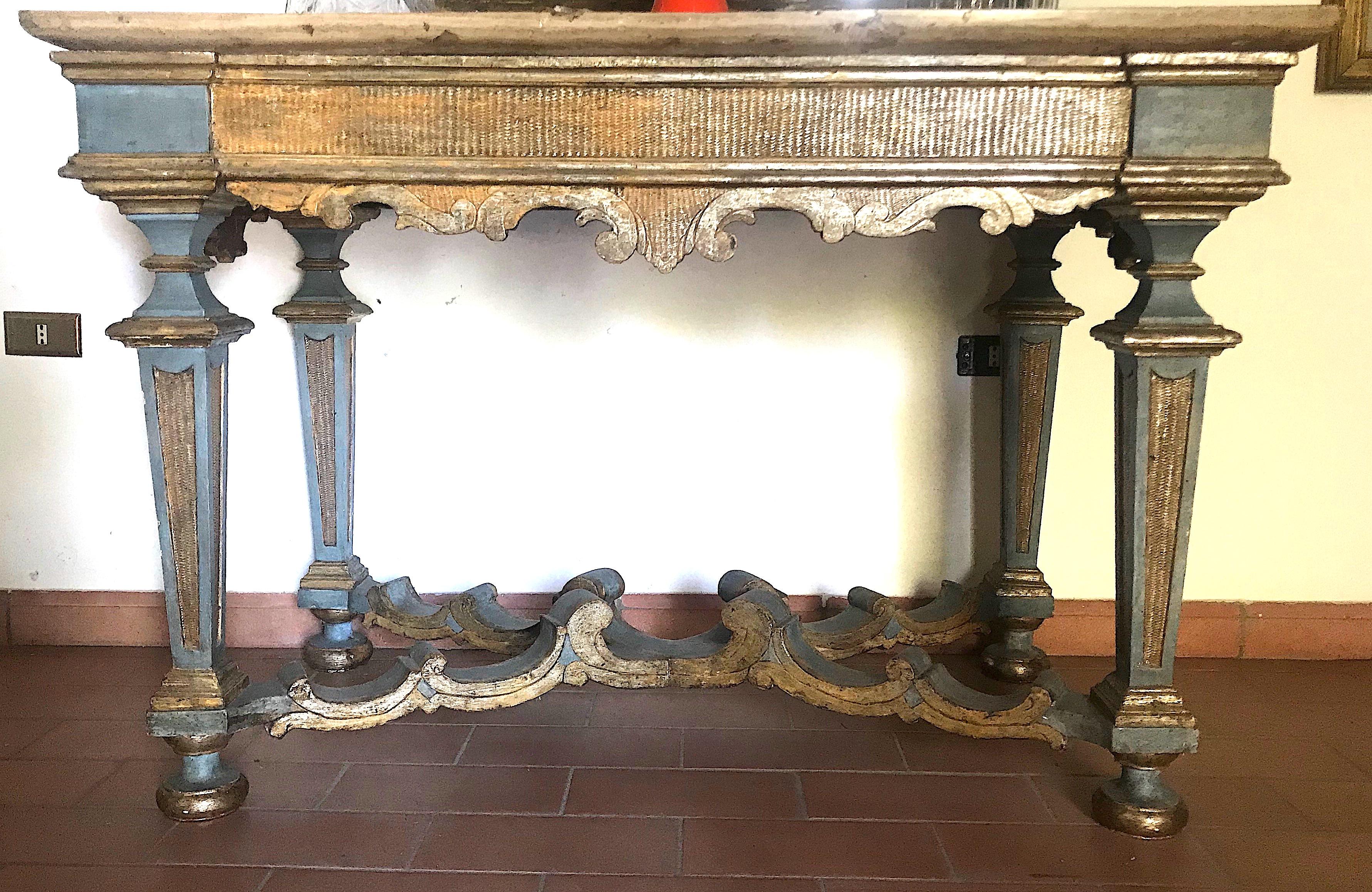 Elegant Italian 17th century light blue painted and parcel-gilt console tables with a marble top.
Provenience from a Tuscany aristocratic estate.
Rustic elegance decor.
  