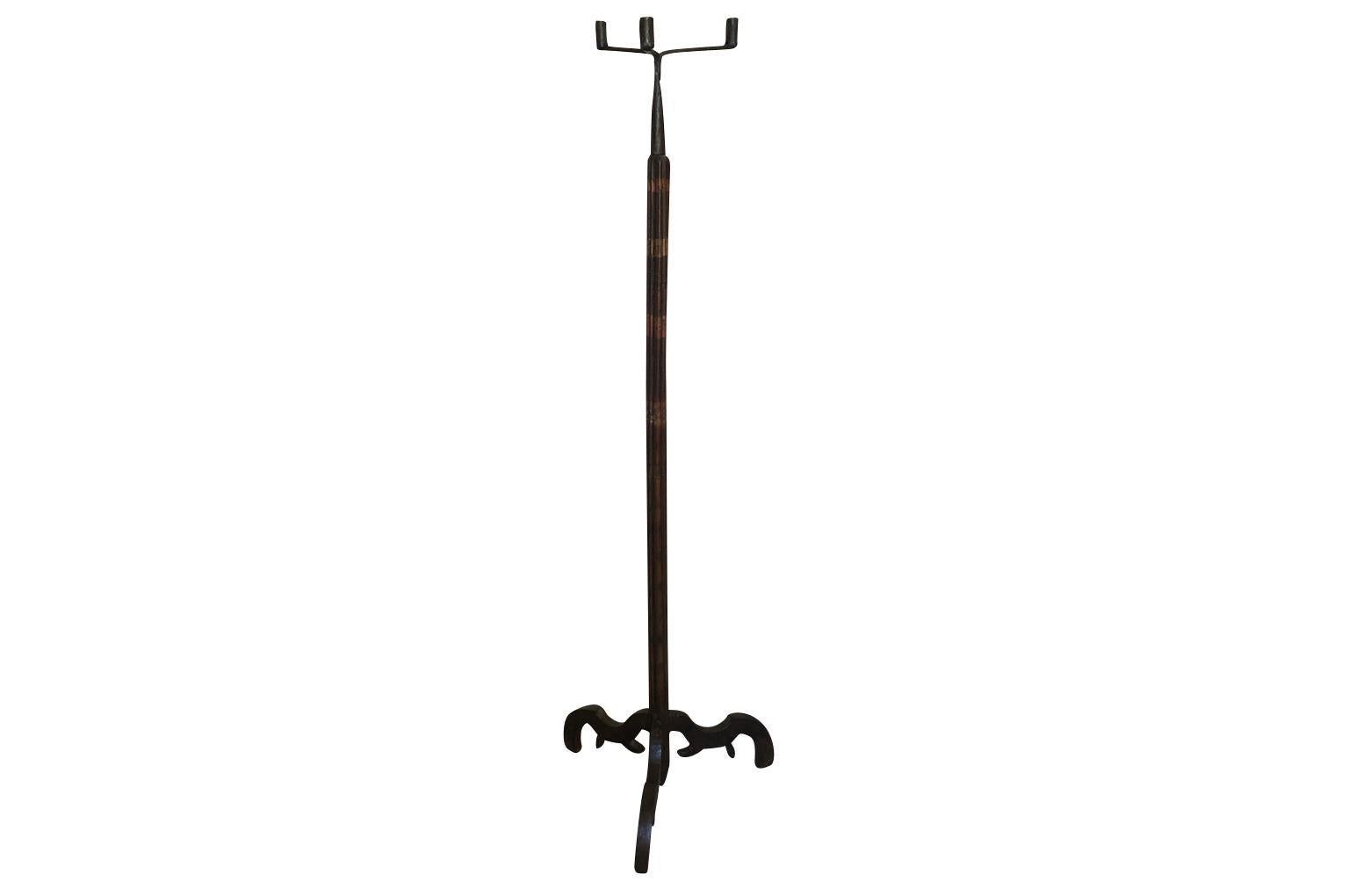A very handsome 17th century Pique Cierge, floor lamp from the Lombardi region of Italy in polychromed wood and iron. Wonderful patina.